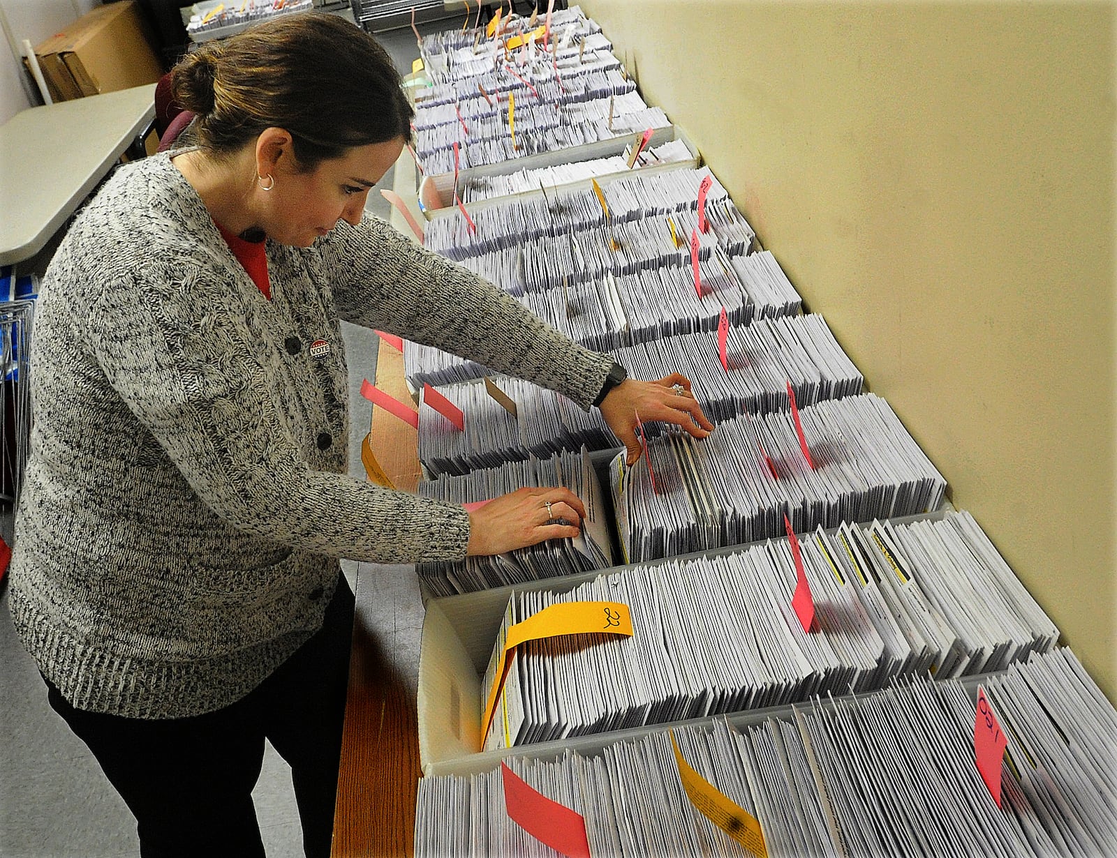 Alisha Lampert, Director of the Greene County Board of Elections looks over absentee ballots Tuesday Nov. 1, 2022.
MARSHALL GORBY\STAFF