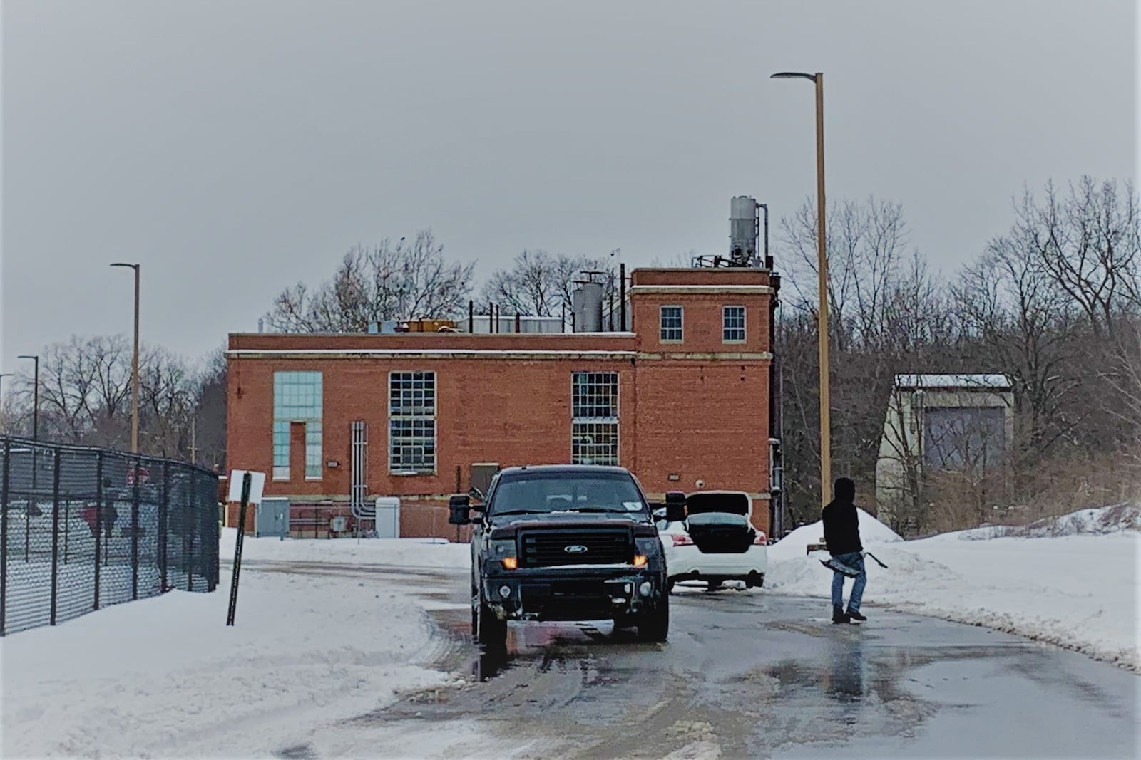 Students helped each other dig their cars out of the snow on the eastern side of campus Friday as snow blanketed Central State. The historic power plant next to some residence halls will be renovated into a Health and Human Services center. LONDON BISHOP/STAFF