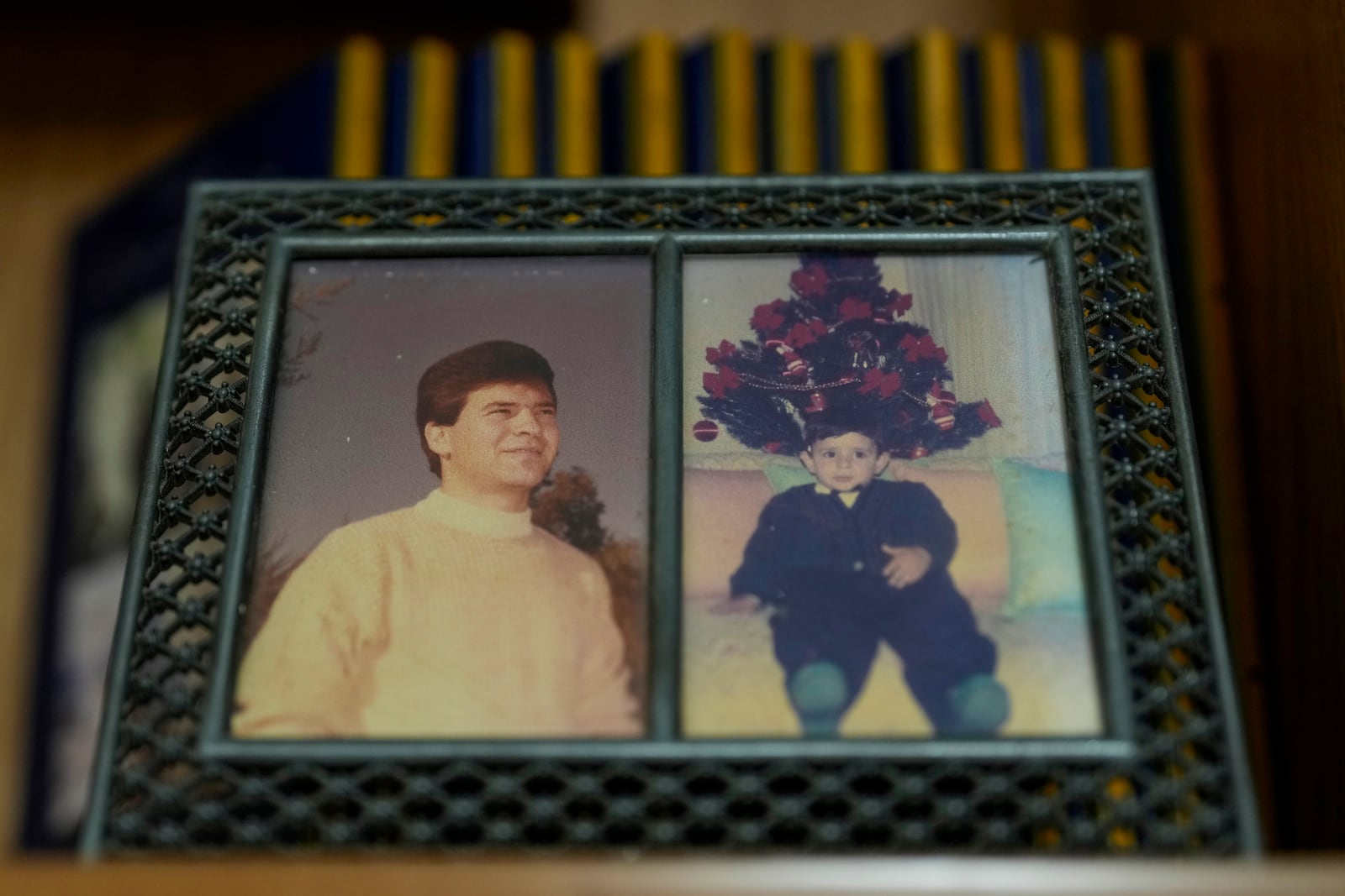 An old picture of Suheil Hamwi, left, who spent 32 years in prison in Syria and returned to Lebanon after the government of Bashar Assad was toppled, sits on a table inside of his home at the northern coastal town of Chekka, Lebanon, Tuesday, Dec. 10, 2024. (AP Photo/Hassan Ammar)