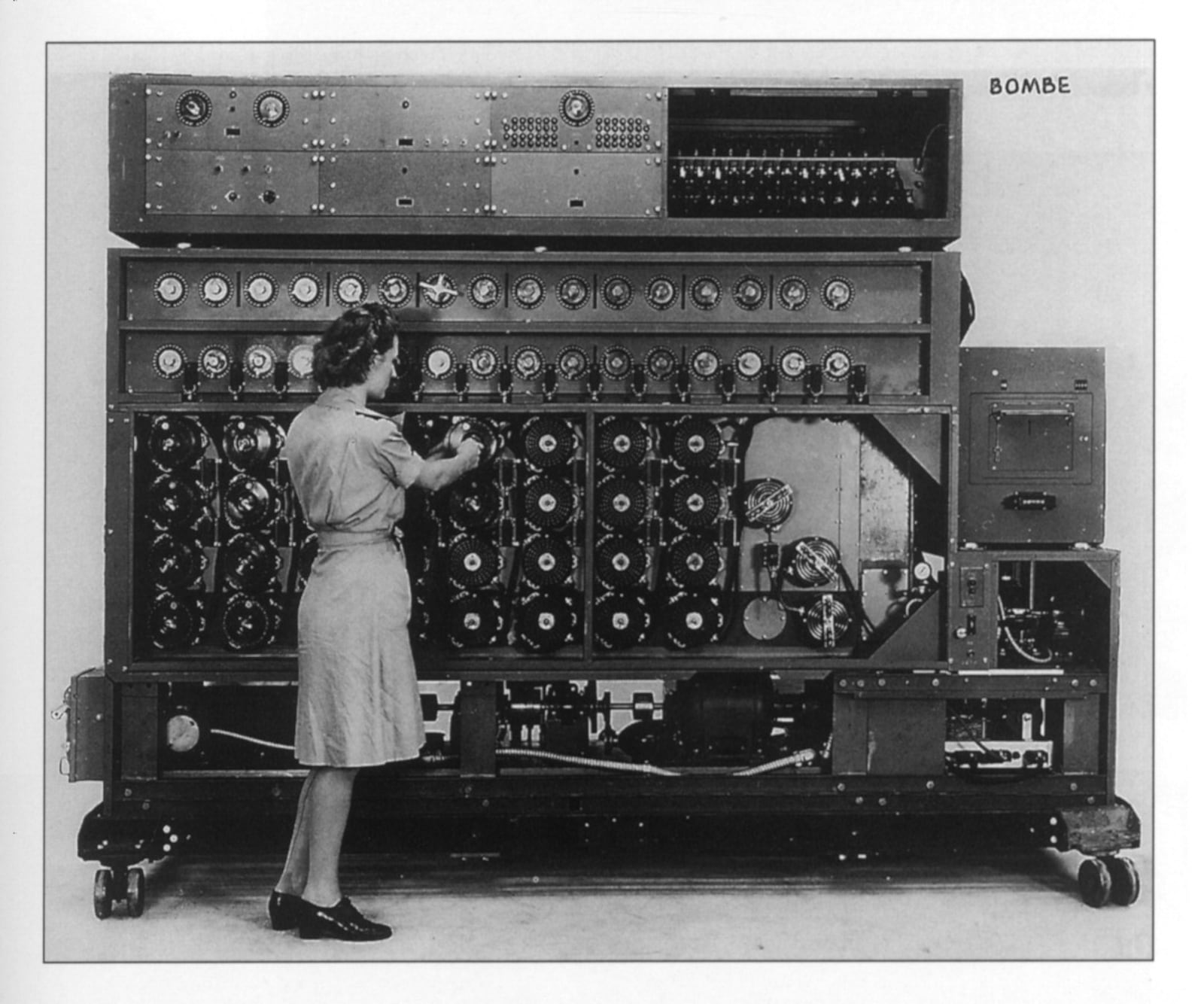 A U.S. Navy WAVE demonstrates the Desch Bombe, one of 120 codebreaking machines designed and built in NCR's Building 26, between 1943-45, for use in cracking the Nazi U-boat and other Enigma codes. Photo: Dayton History 