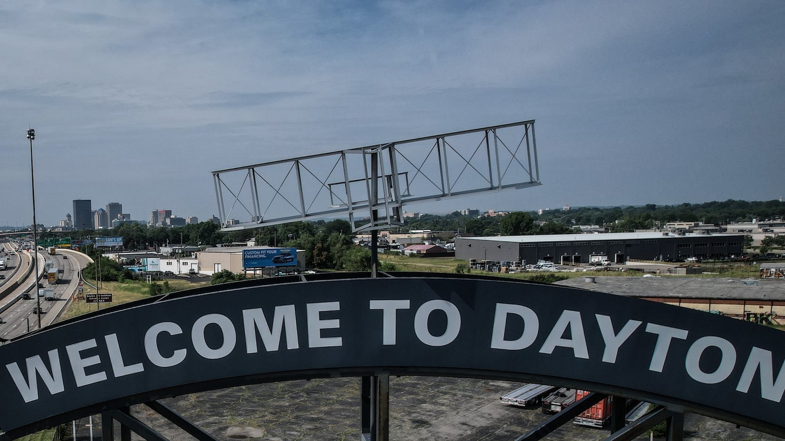 Southbound interstate 75 travelers near Stanley Ave. are welcomed by a large sign with the Wright Brothers flyer perched on top. The Ohio Department of Transportation announced construction on I-75 is expected to continue through 2026. JIM NOELKER / STAFF