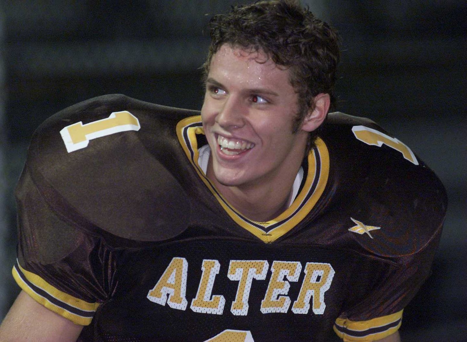 Alter High School’s Doug Penno is all smiles after scoring the first touchdown Friday night against Logan Elm during their Division III quarterfinal game in Kettering.