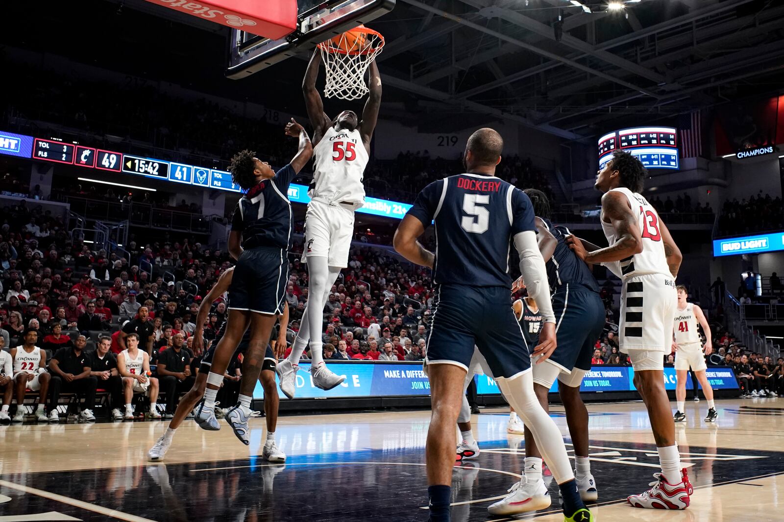 Cincinnati forward Aziz Bandaogo (55) dunks against Howard guard Blake Harper (7) during the second half of an NCAA college basketball game, Sunday, Dec. 8, 2024, in Cincinnati. (AP Photo/Jeff Dean)