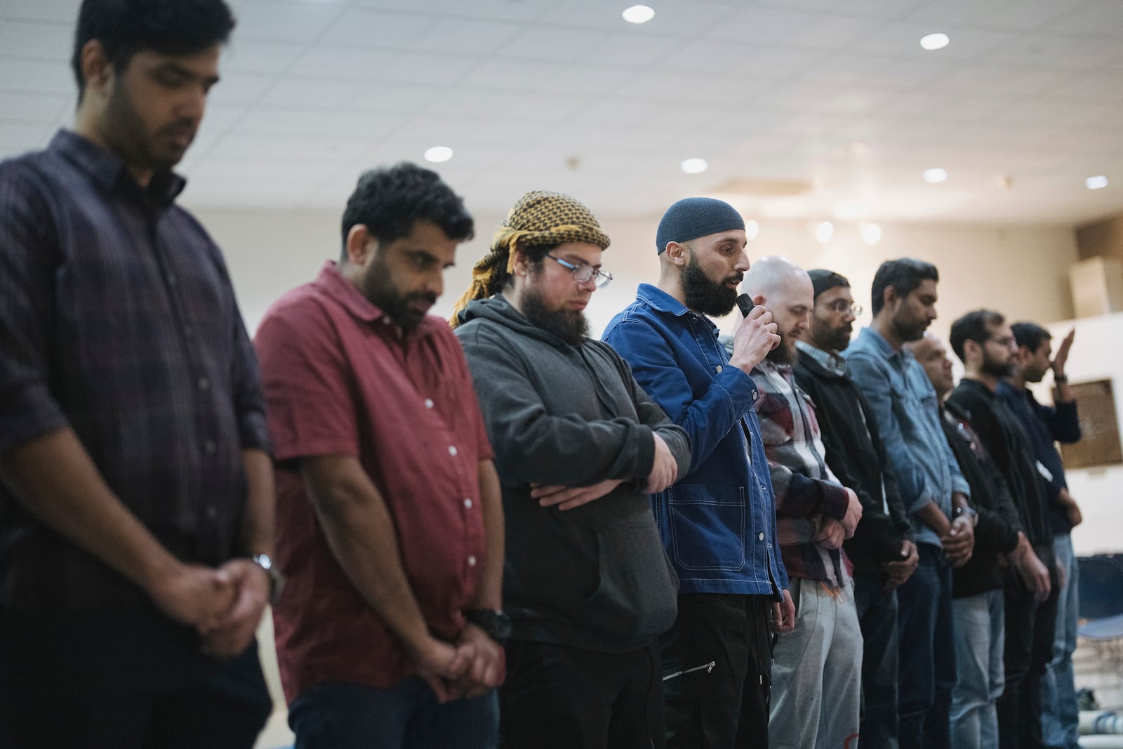 Salah Eddine Benatia, center, speaks during a community gathering to discuss plans for Ramadan held for members of Masjid Al-Taqwa, held at a school in Pasadena, California, Saturday, Feb. 15, 2025. (AP Photo/Eric Thayer)