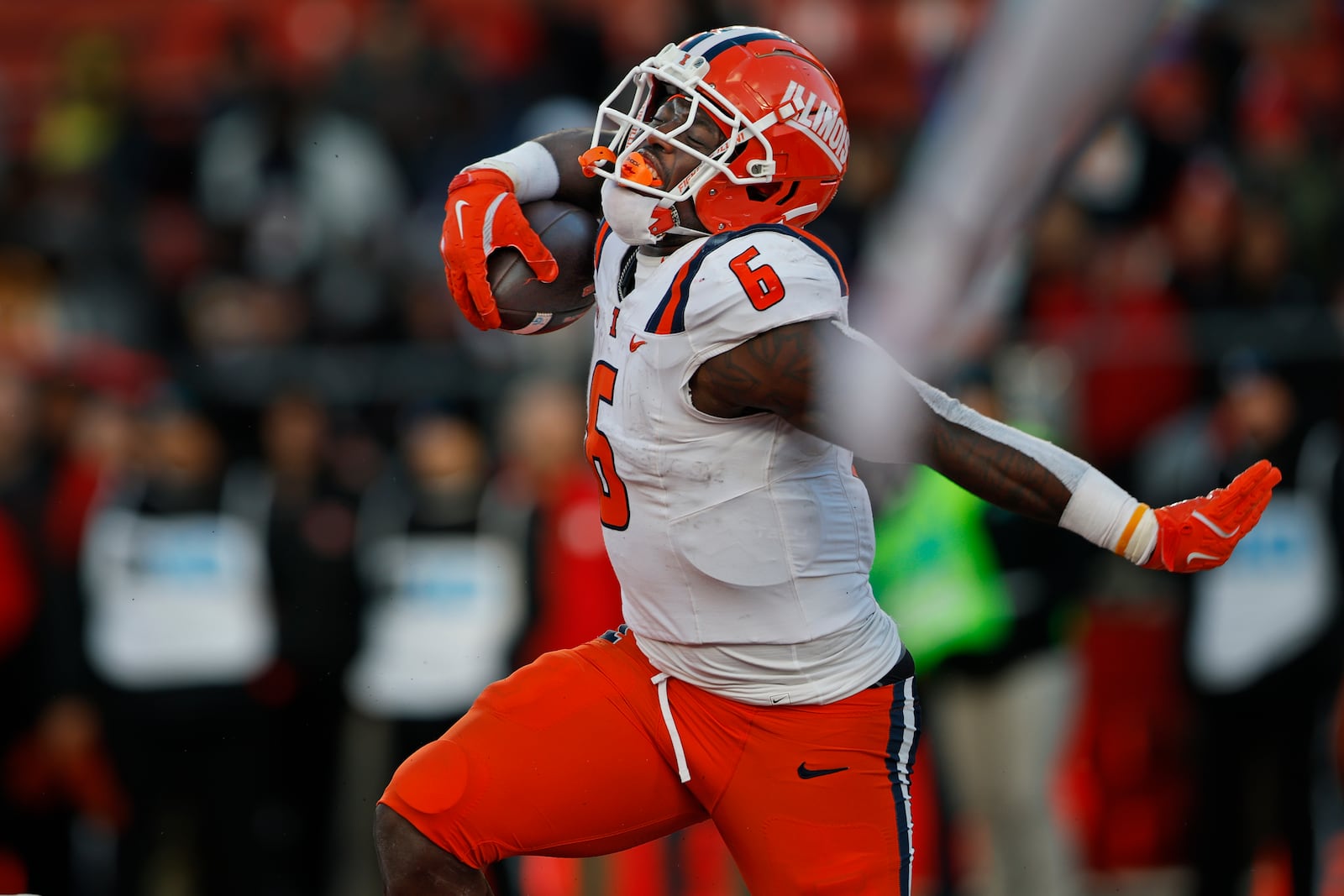 Illinois running back Josh McCray (6) reacts after scoring a two-point conversion against Rutgers during the second half of an NCAA college football game, Saturday, Nov. 23, 2024, in Piscataway, N.J. Illinois defeated Rutgers 38-31. (AP Photo/Rich Schultz)