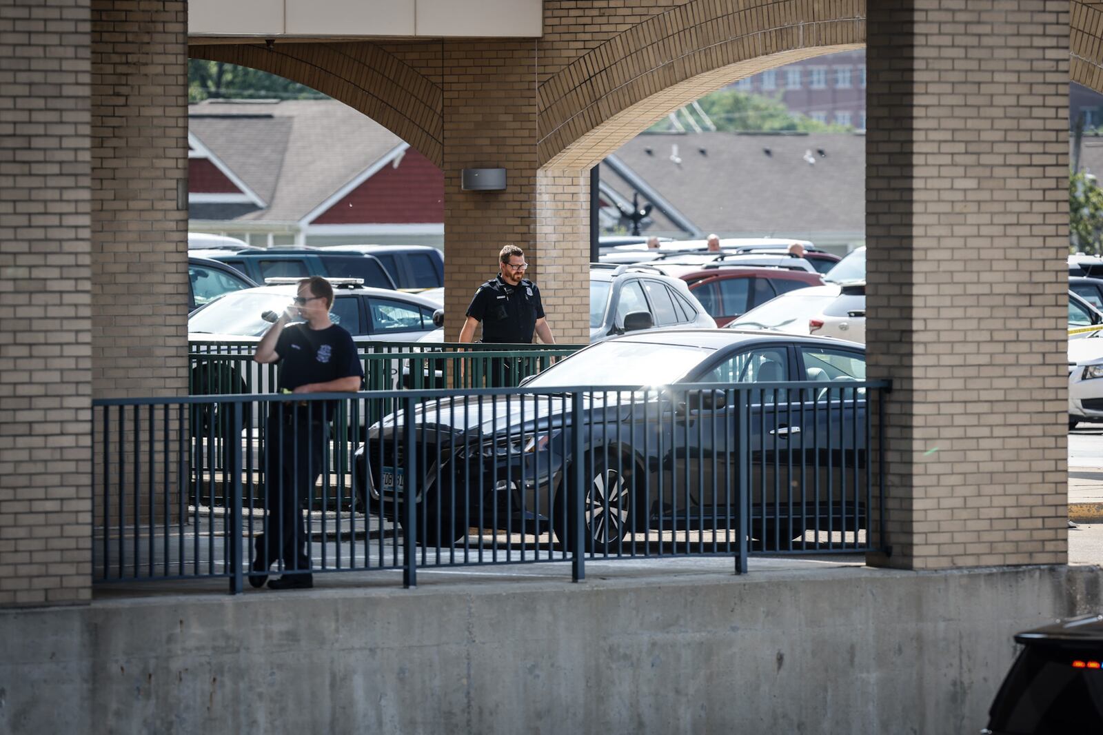 Police are shown at the emergency room entrance of Miami Valley Hospital on Wednesday, June 1, 2022.  A Montgomery County Jail inmate shot and killed a private security guard and then himself in a shooting at the hospital. JIM NOELKER/STAFF