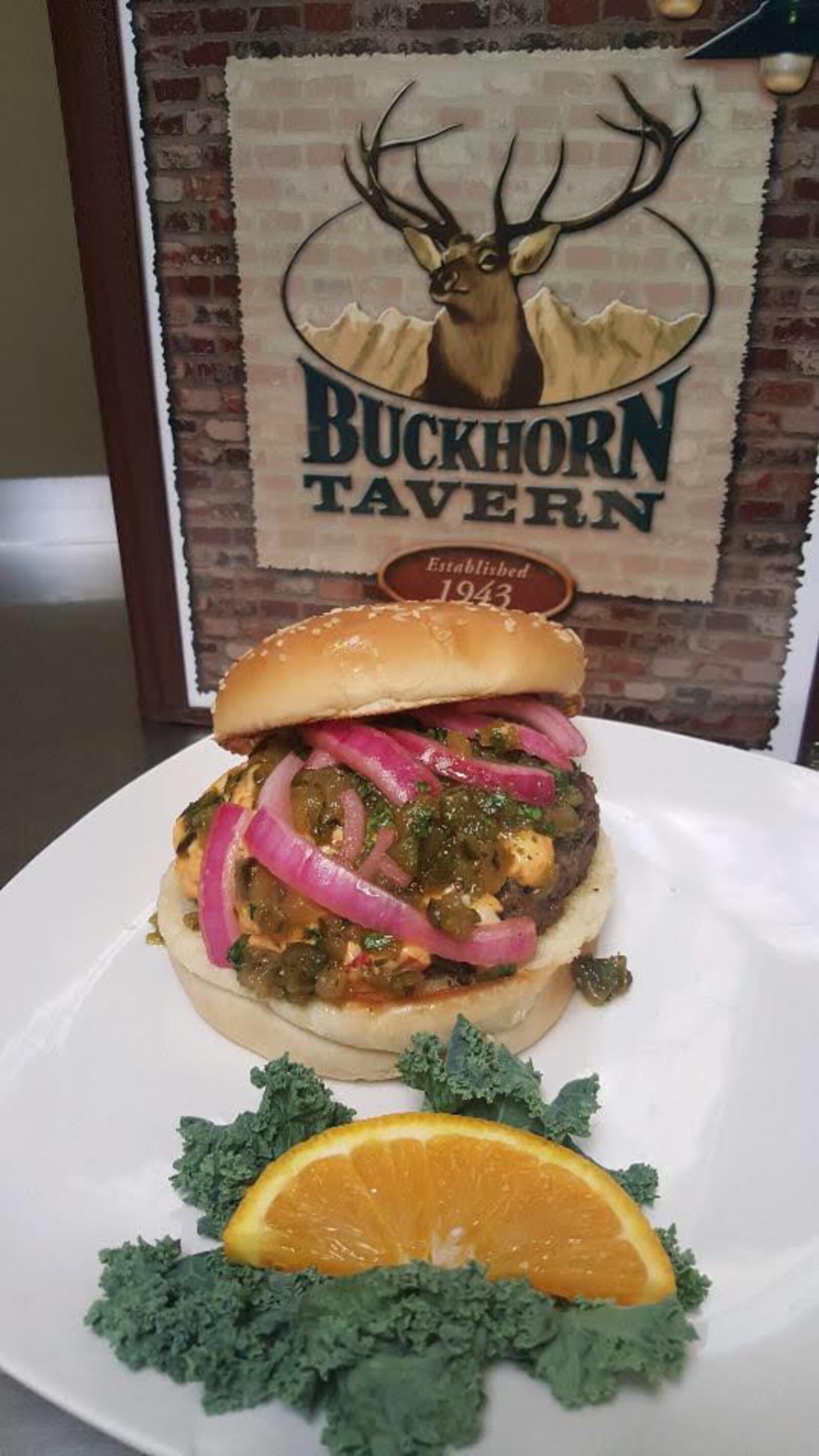 Buckhorn Tavern's  Green Chile Burger, a half-pound ground beef, roasted green chiles and poblano peppers, pickled red onions. CONTRIBUTED