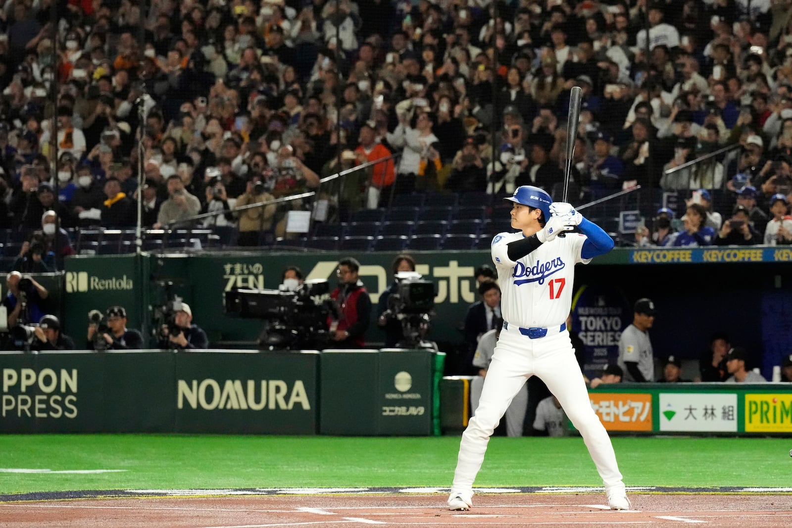 Los Angeles Dodgers' Shohei Ohtani waits on a pitch in the first inning of a spring training baseball game against the Yomiuri Giants in Tokyo, Japan, Saturday, March 15, 2025. (AP Photo/Eugene Hoshiko)