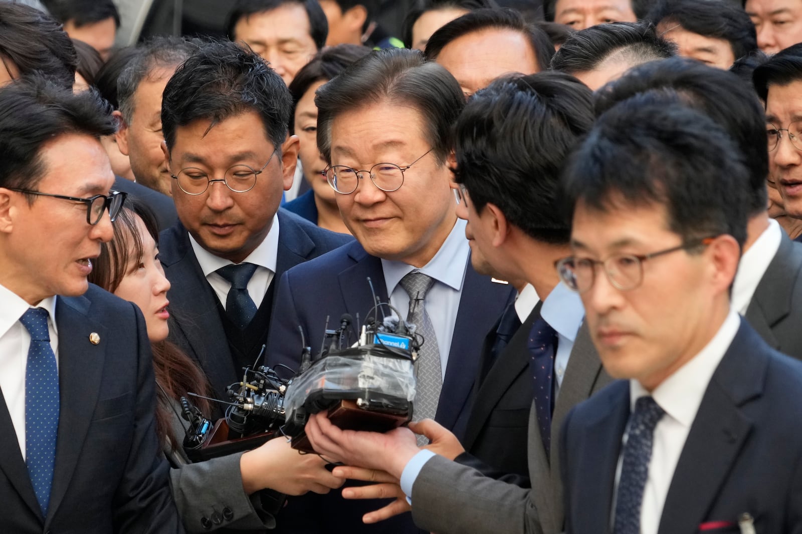 South Korea's main opposition Democratic Party leader Lee Jae-myung, center, arrives at the Seoul Central District Court in Seoul, South Korea, Friday, Nov. 15 2024. (AP Photo/Ahn Young-joon)