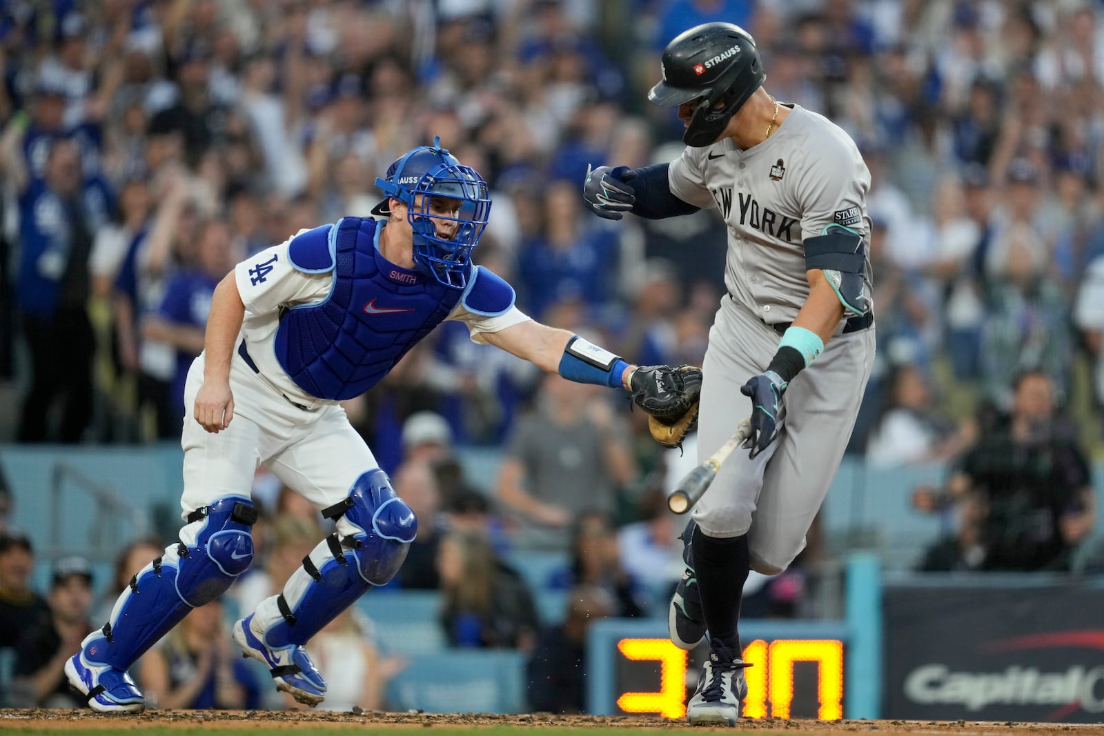 New York Yankees' Aaron Judge is tagged out by Los Angeles Dodgers catcher Will Smith during the third inning in Game 1 of the baseball World Series, Friday, Oct. 25, 2024, in Los Angeles. (AP Photo/Ashley Landis)