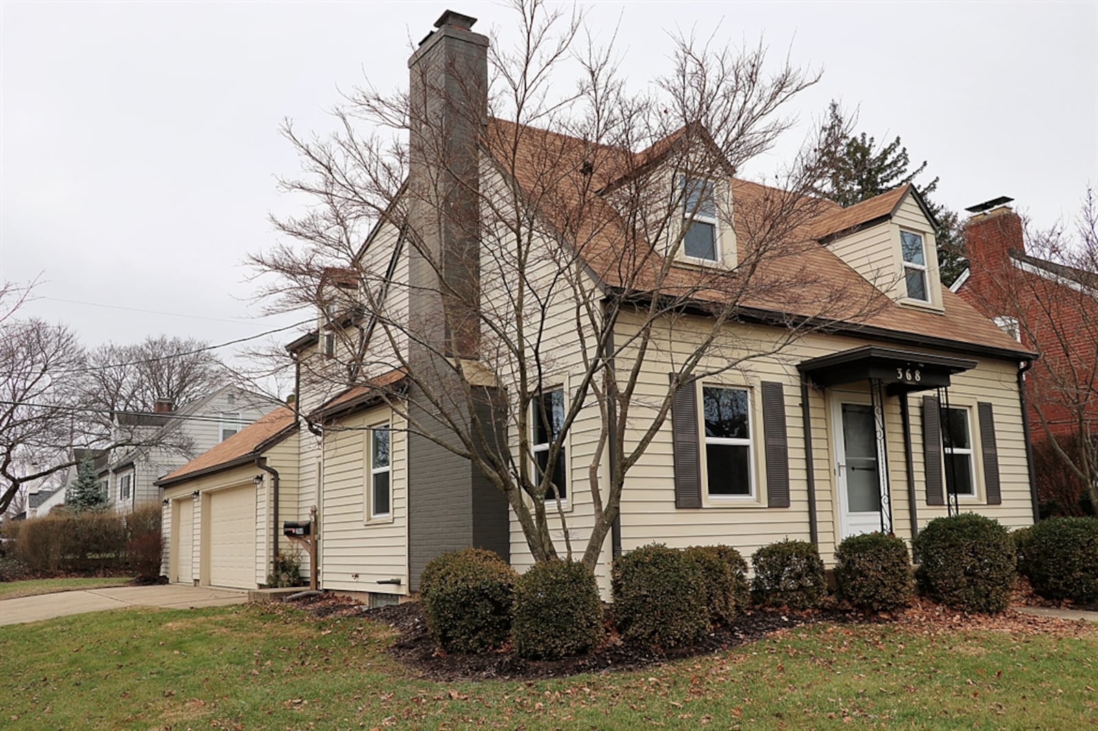 The house sits on a corner lot with a side-entry, three-car garage. 