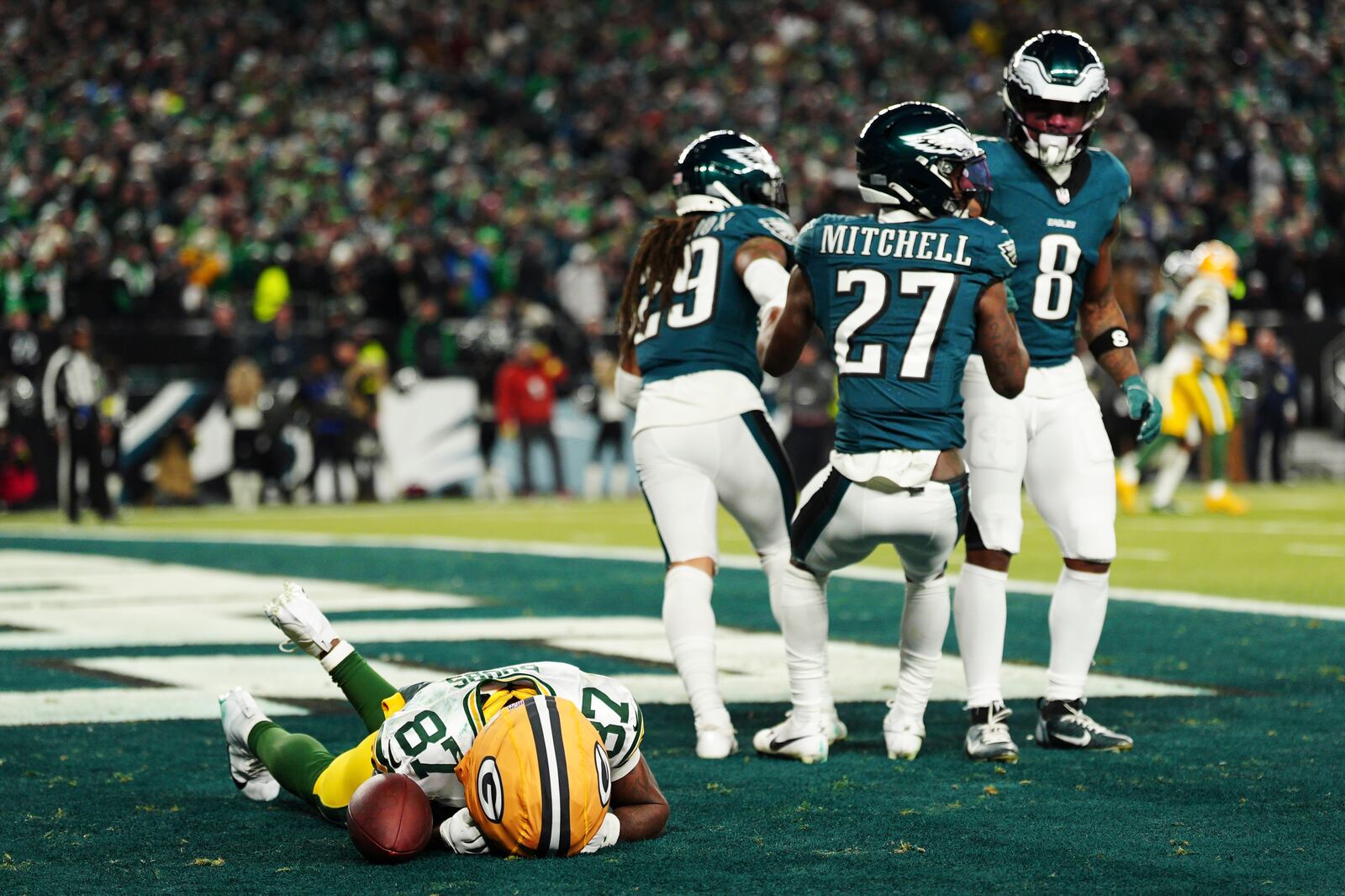 Green Bay Packers wide receiver Romeo Doubs (87) reacts after missing a catch during the second half of an NFL wild-card playoff football game against the Philadelphia Eagles on Sunday, Jan. 12, 2025, in Philadelphia. Doubs was injured on the play. (AP Photo/Derik Hamilton)