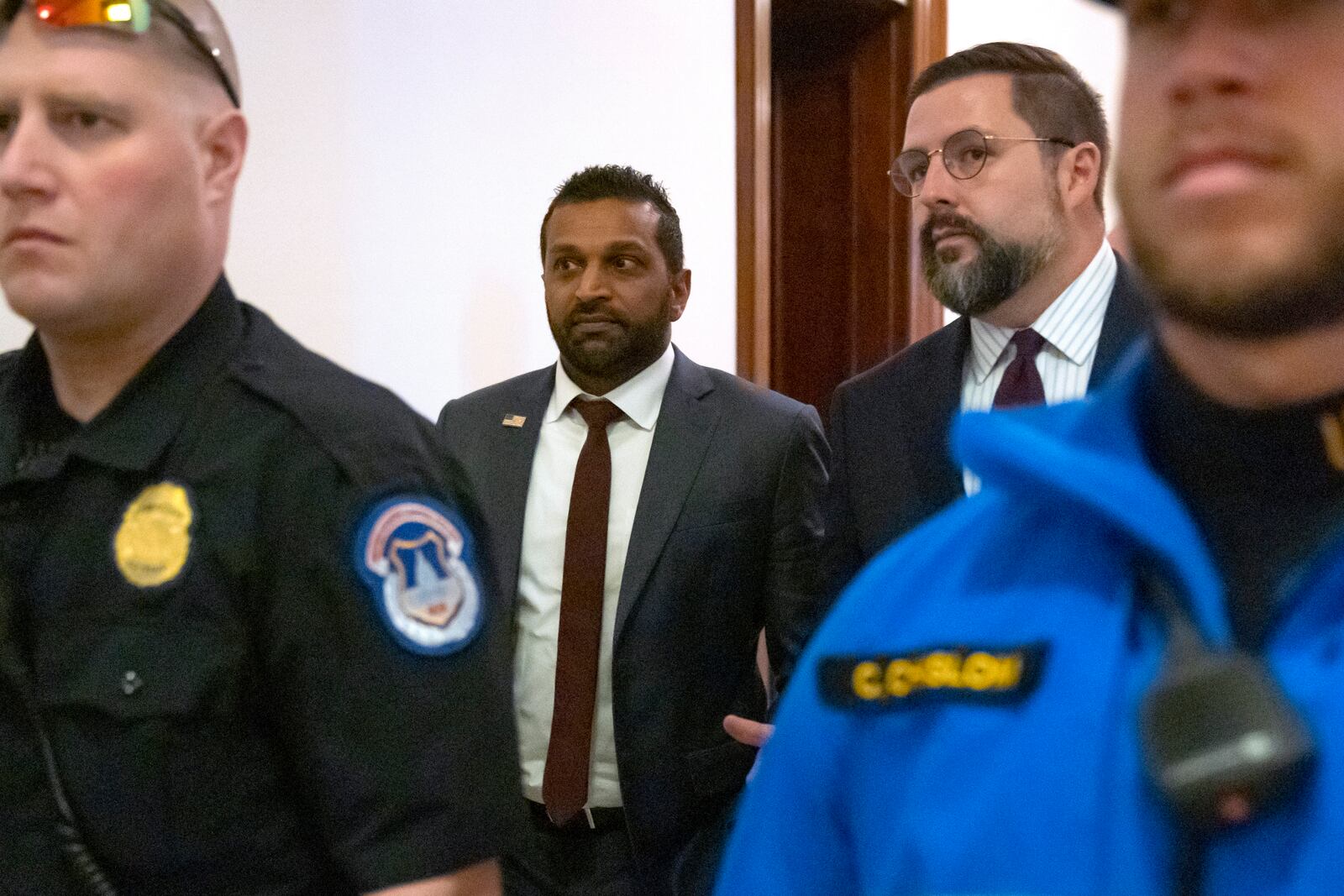 FILE - Kash Patel, President-elect Donald Trump's pick to be the director of the FBI, walks between meetings on Capitol Hill, Dec. 9, 2024, in Washington. (AP Photo/Mark Schiefelbein, File)