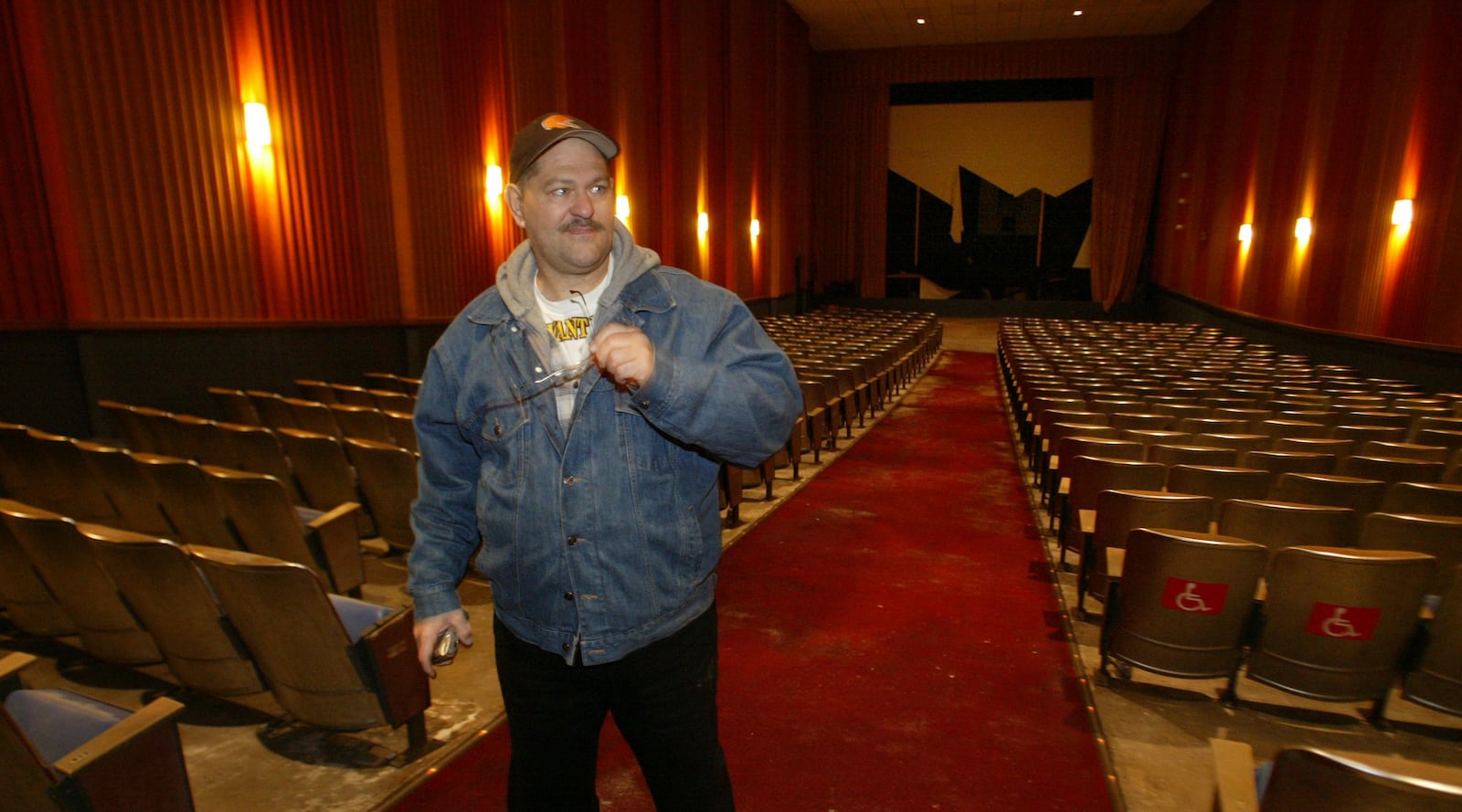 William Krest of Trotwood takes one last look around the  inside the Kon-Tiki movie theatre Tuesday morning before demolition of the building began. Krest said he remembers breaking up with a girlfriend 20 years ago during a movie at the theatre.  Photo by Lisa Powell