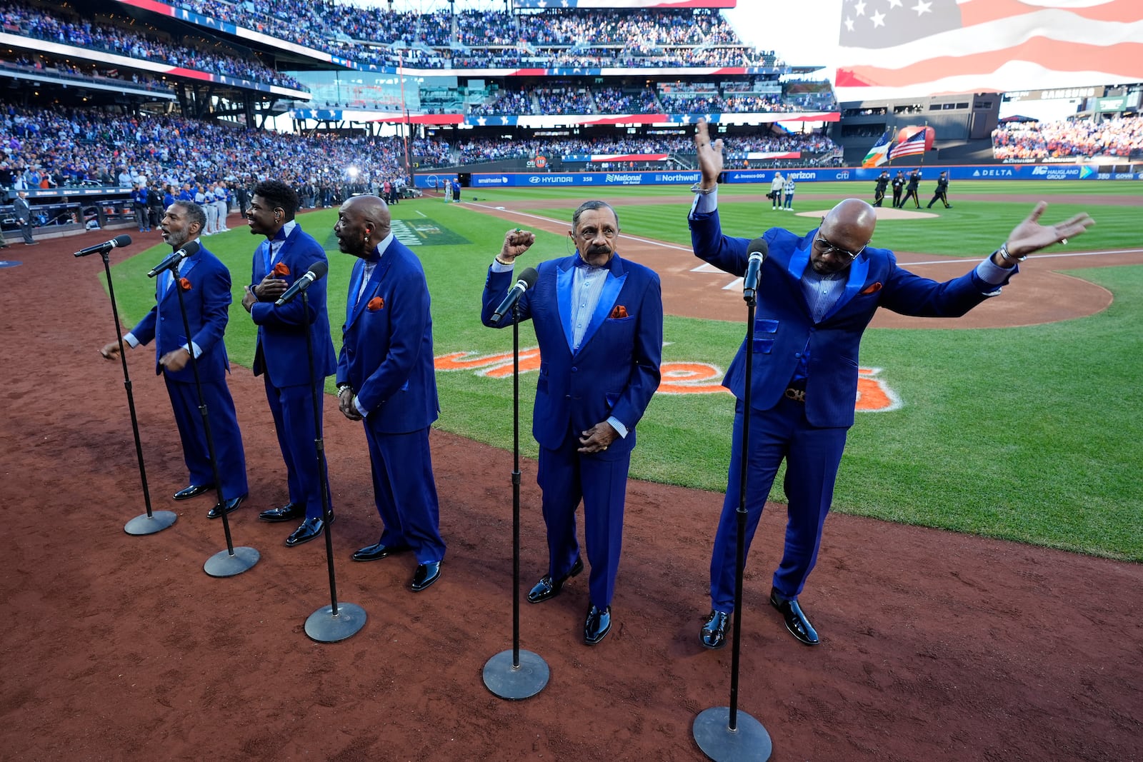 The Temptations perform before Game 5 of a baseball NL Championship Series between the Los Angeles Dodgers and the New York Mets, Friday, Oct. 18, 2024, in New York. (AP Photo/Frank Franklin II)