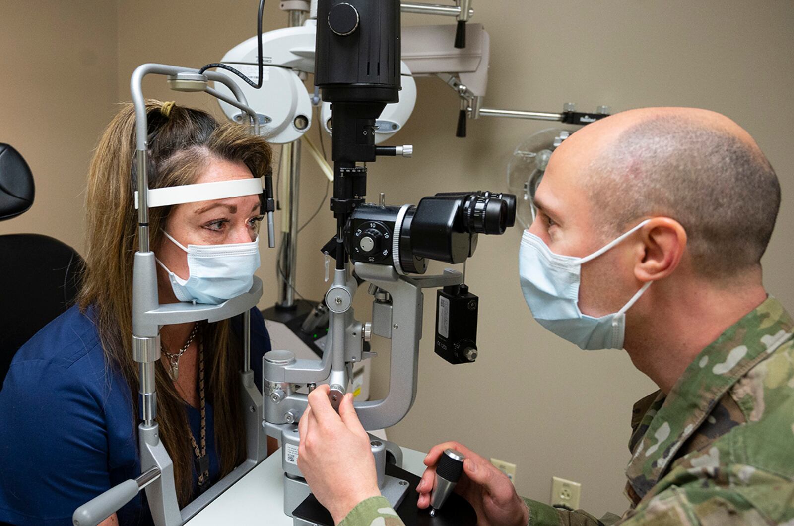 Lt. Col. Michael Tommolino, commander of the 88th Operational Medical Readiness Squadron’s Optometry Flight, demonstrates the use of a slit lamp biomicroscope Jan. 25 with Gerri Bradley, an optometry technician, in Wright-Patterson Medical Center’s Optometry Clinic. Optometrists are part of the Biomedical Sciences Corps, whose mission is to “provide full-spectrum allied health support to optimize health and readiness for all we serve.” U.S. AIR FORCE PHOTO/R.J. ORIEZ