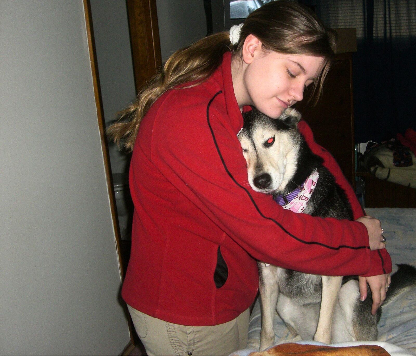 Bellinger has always had a deep love for animals and advocates for them because they don't have voices of their own. Here she hugs her companion dog, Shelby.