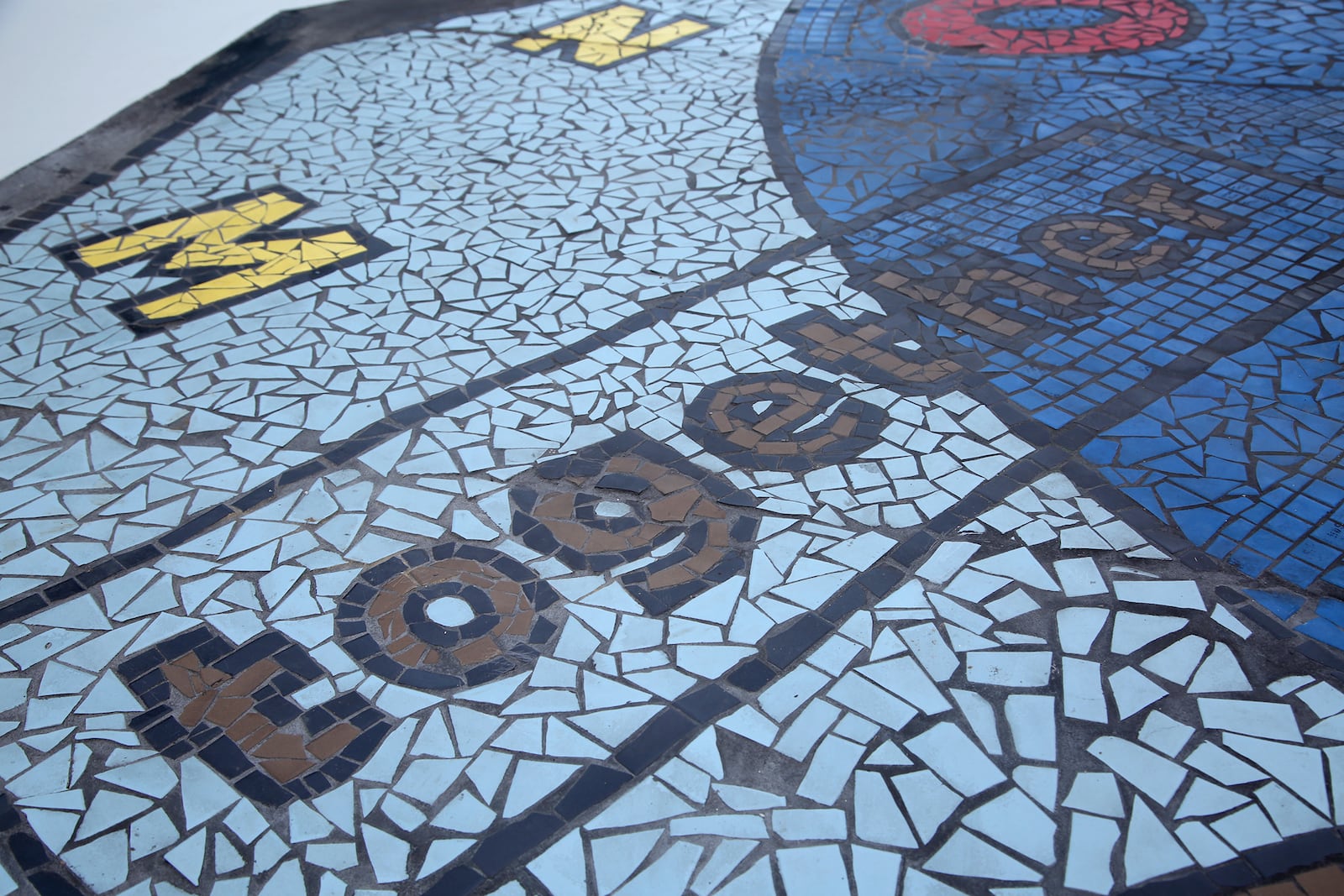 "Together We Rise," is a new large-scale play area and work of art in West Dayton. The in-ground mosaic is a play station designed with interactive games, alphabet letters and raised areas for crayon rubbings. It is located in a playground at the intersection of Harvard Boulevard and Burroughs Drive on the Omega CDC Harvard Campus.  LISA POWELL / STAFF