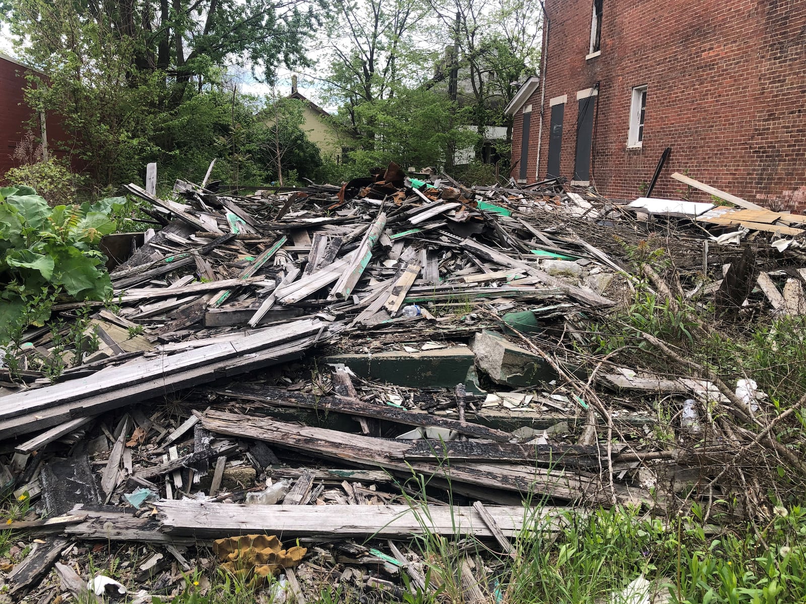 A pile of debris from an emergency demolition following a fire at a property on the 2100 block of East Third Street. CORNELIUS FROLIK / STAFF