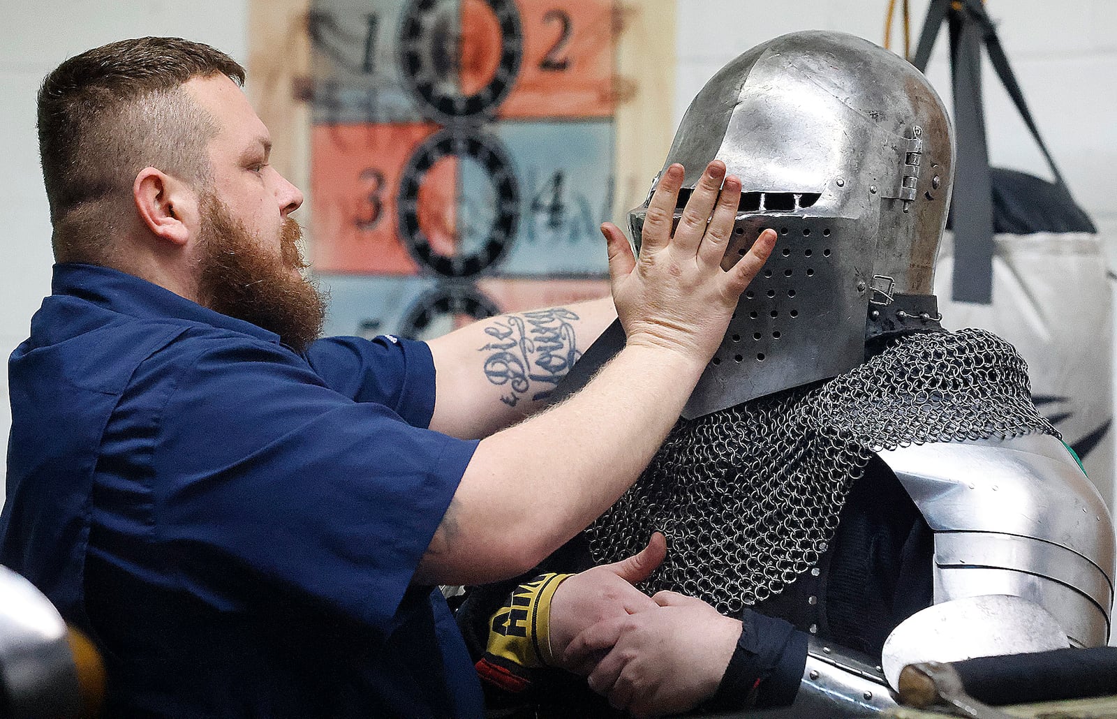 Travis Young (left) squires for Gabriel Hutchings during a Cincinnati Barbarians practice Thursday, Feb. 13, 2025. MARSHALL GORBY\STAFF