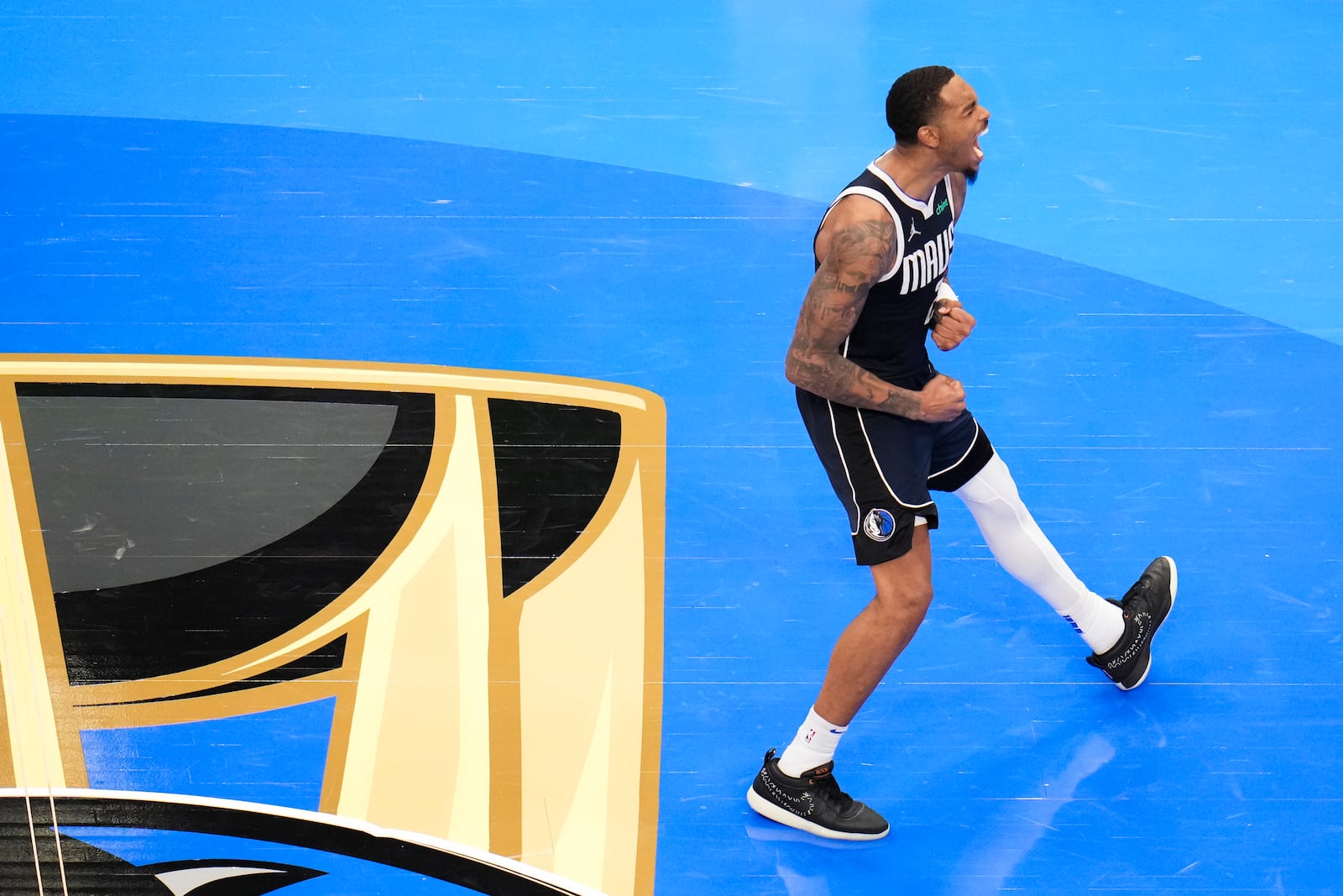 Dallas Mavericks forward P.J. Washington reacts after scoring a basket against the Memphis Grizzlies during the second half of an Emirates NBA Cup basketball game, Tuesday, Dec. 3, 2024, in Dallas. The Mavericks won 121-116. (AP Photo/Julio Cortez)