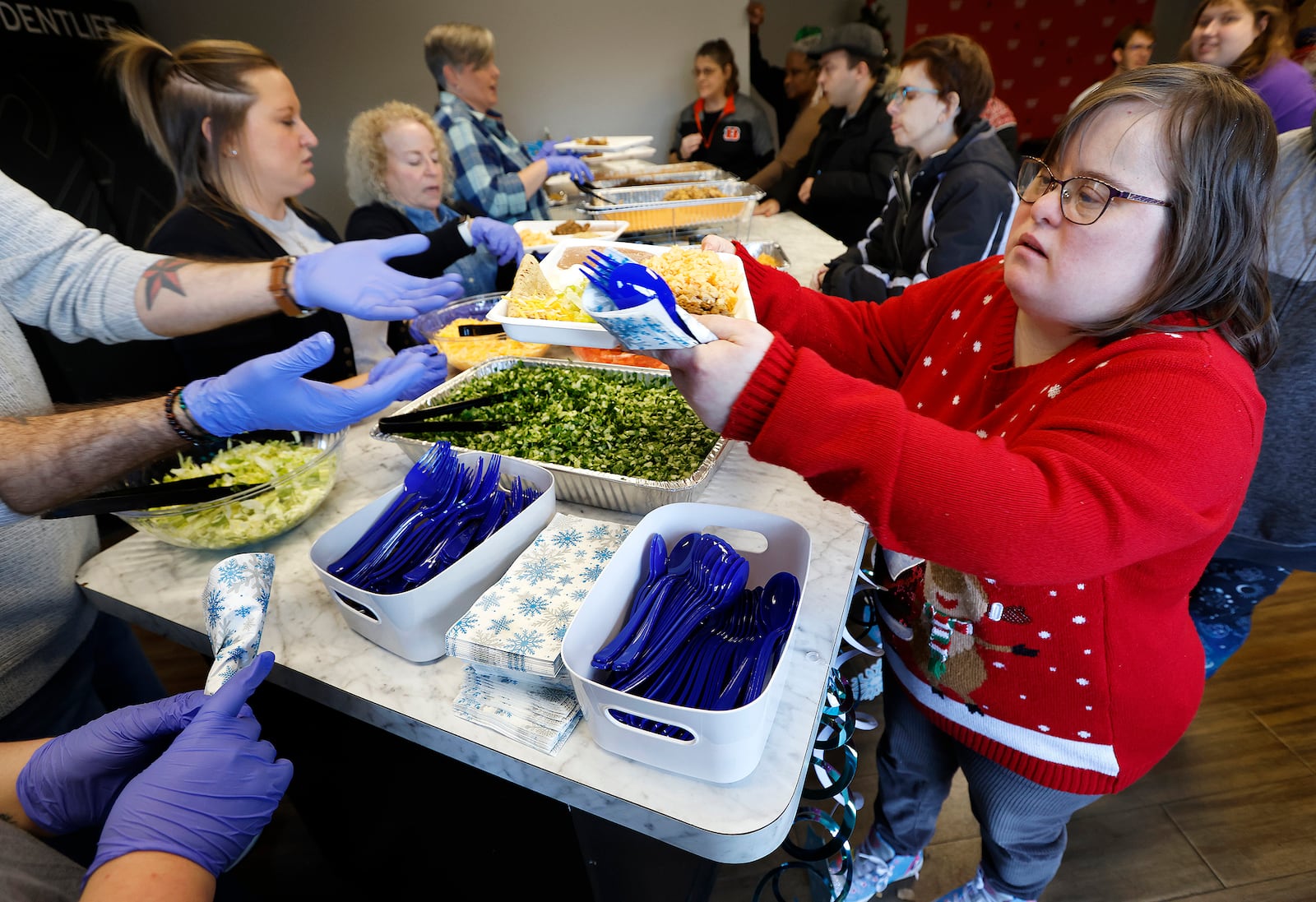 Stacy Gould along with 175 individuals with developmental disabilities enjoyed lunch and dancing Dec. 3, 2024 at a Holiday Dance at the Christian Life Center in Vandalia. MARSHALL GORBY\STAFF