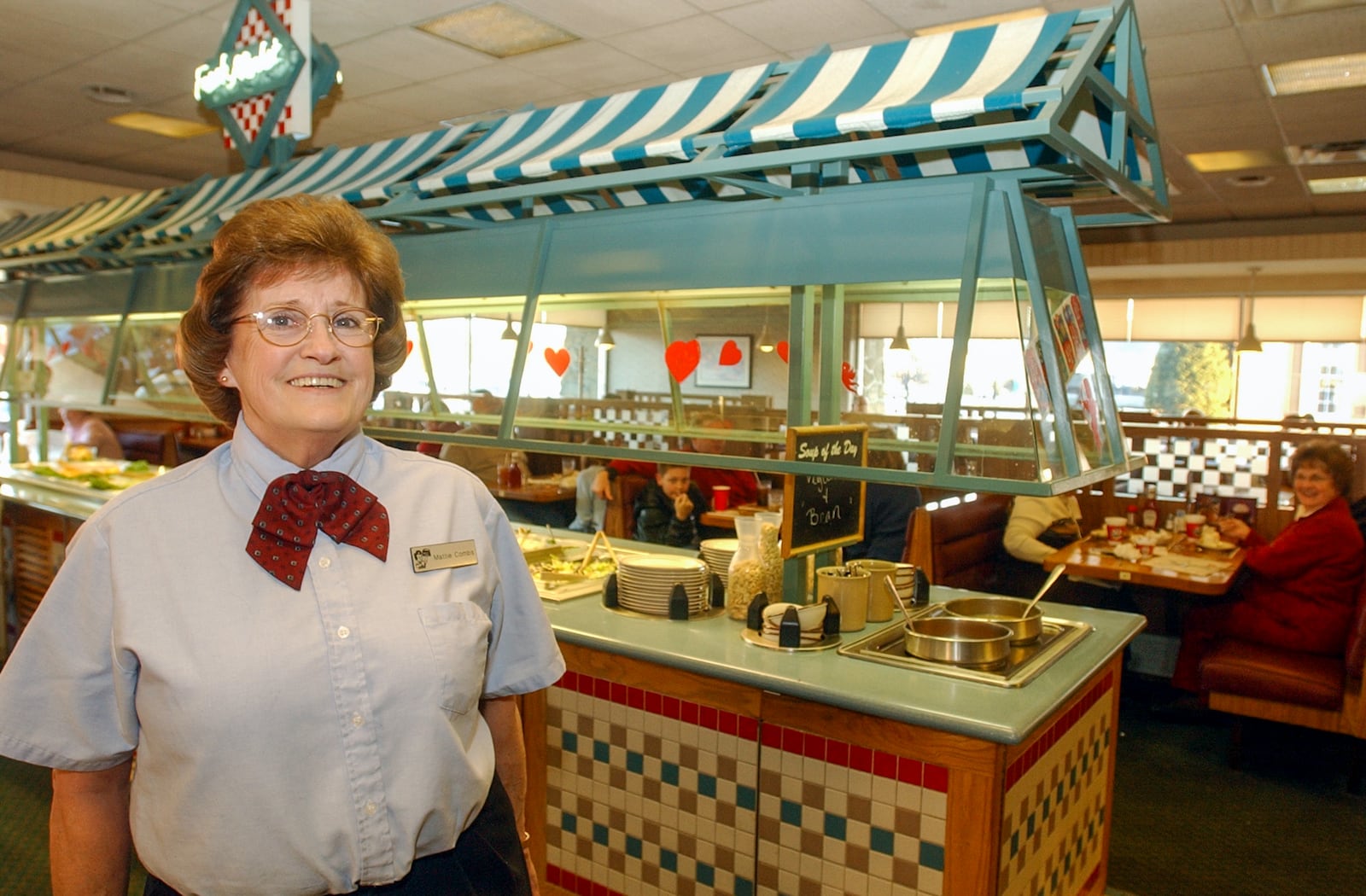 Mattie Combs, shown in this 2004 photo in Hamilton's Main Street Frisch's, was one of many southwest Ohioans who started with a job at the restaurant. In her case, she started as a car hop and stayed 40 years, working her way up the ladder to executive manager. JOURNAL NEWS FILE PHOTO