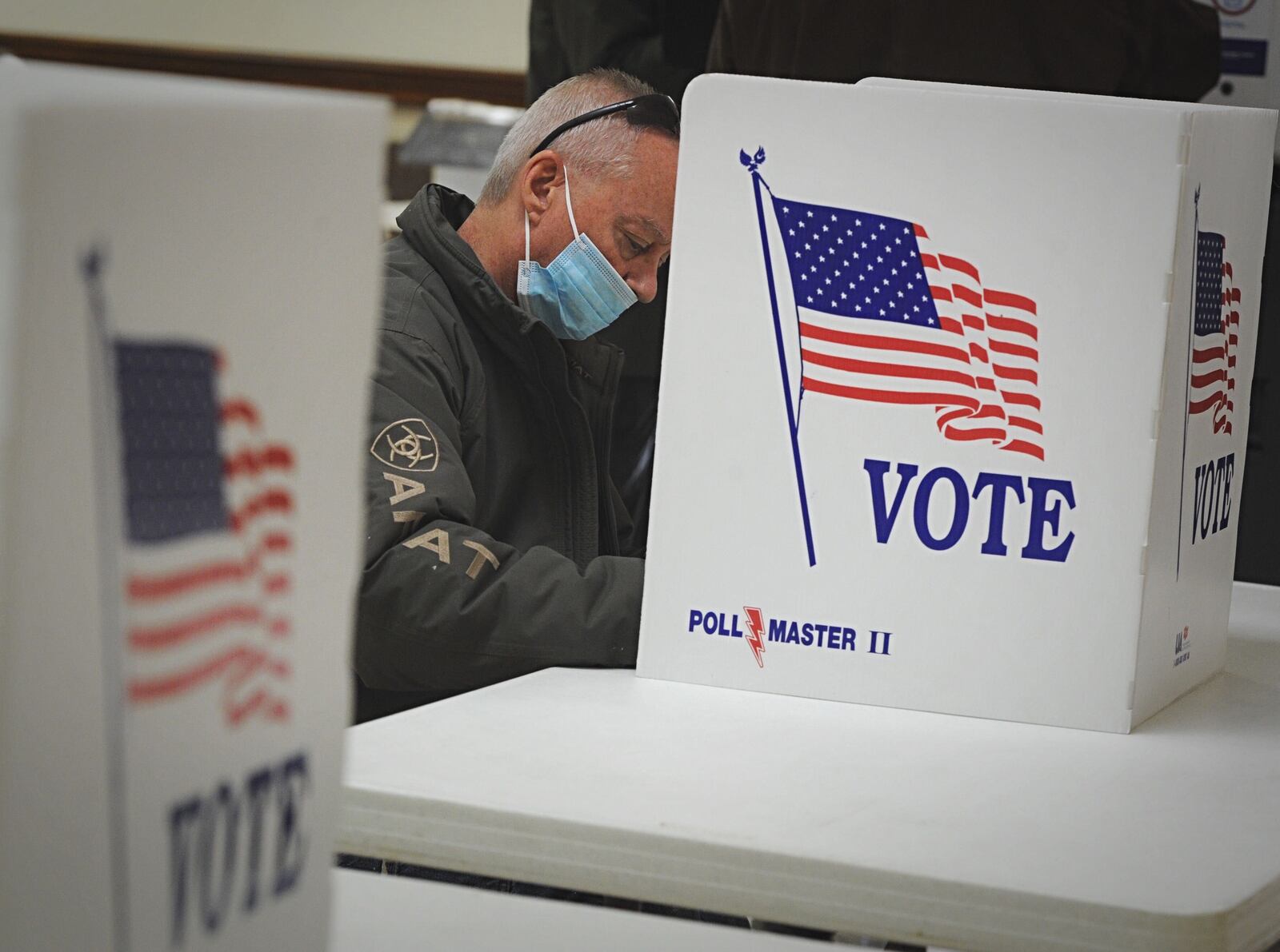 Voting at the Belmont Church of Christ in Dayton Tuesday morning. MARSHALL GORBY\STAFF