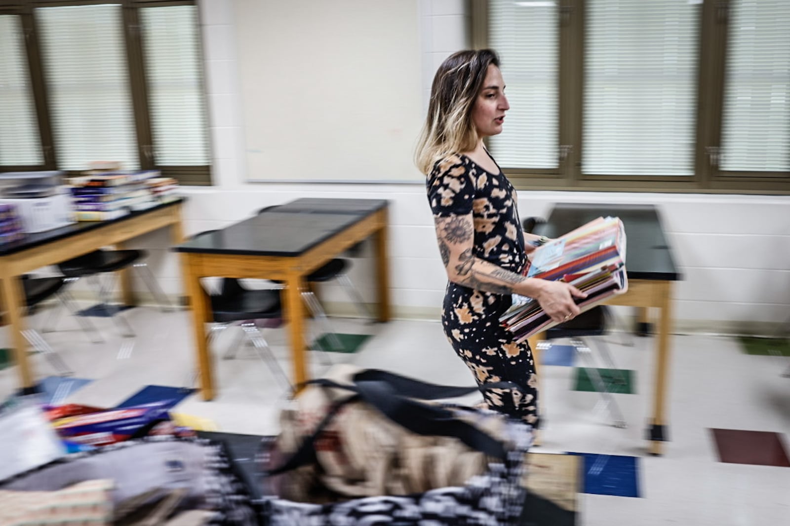 E.J. Brown Middle School science teacher Casi Hardin prepares her classroom for the first day of school Monday. JIM NOELKER/STAFF