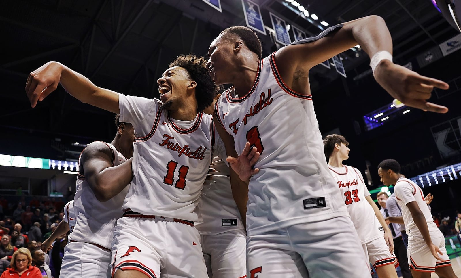 Fairfield's Logan Woods, left, and Kollin Tolbert celebrate a 51-42 win over Wayne in their Division I regional basketball game Wednesday, March 9, 2022 at Cintas Center on the Xavier University campus in Cincinnati. NICK GRAHAM/STAFF