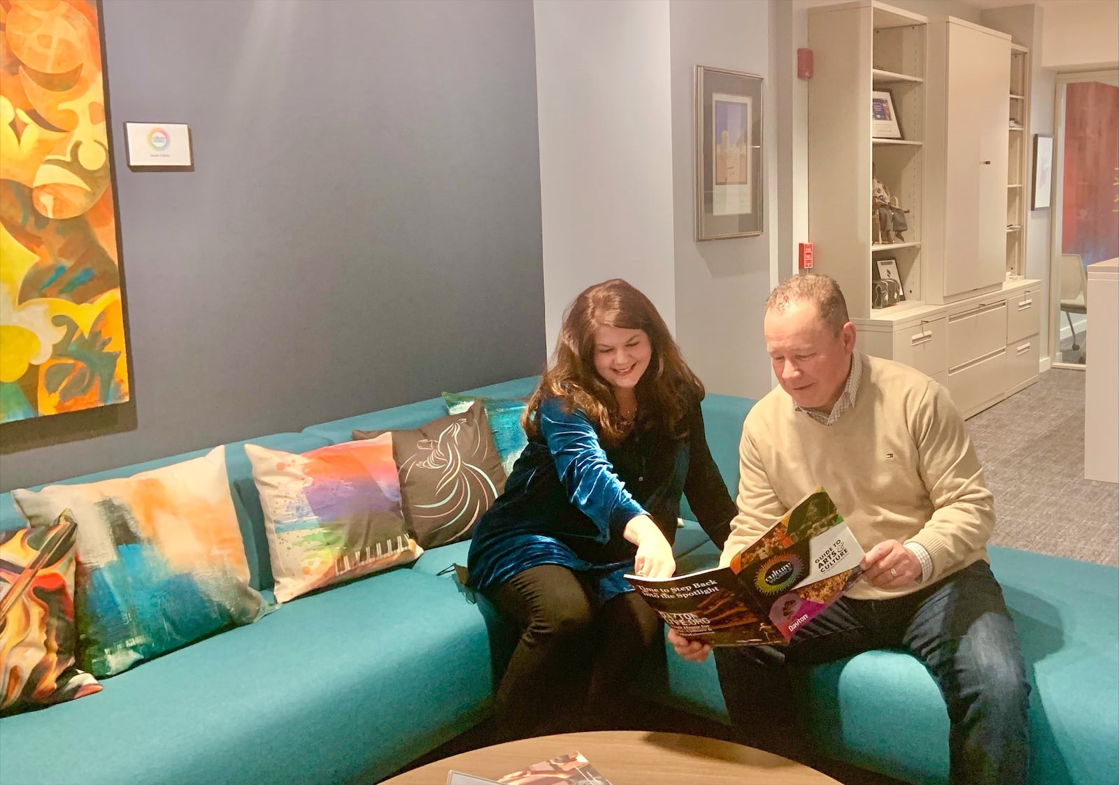 The Culture Works office is now located on the 2nd Floor of the Arcade in the former Charley’s Crab space. It looks a little different now. Culture Works President/CEO Lisa Hanson reviews the 2021-2022 Guide to Arts & Culture in the Dayton Region with Dave Litteral, Market President for iHeart Media and a Culture Works Board of Trustee Member.  Provided Photo.