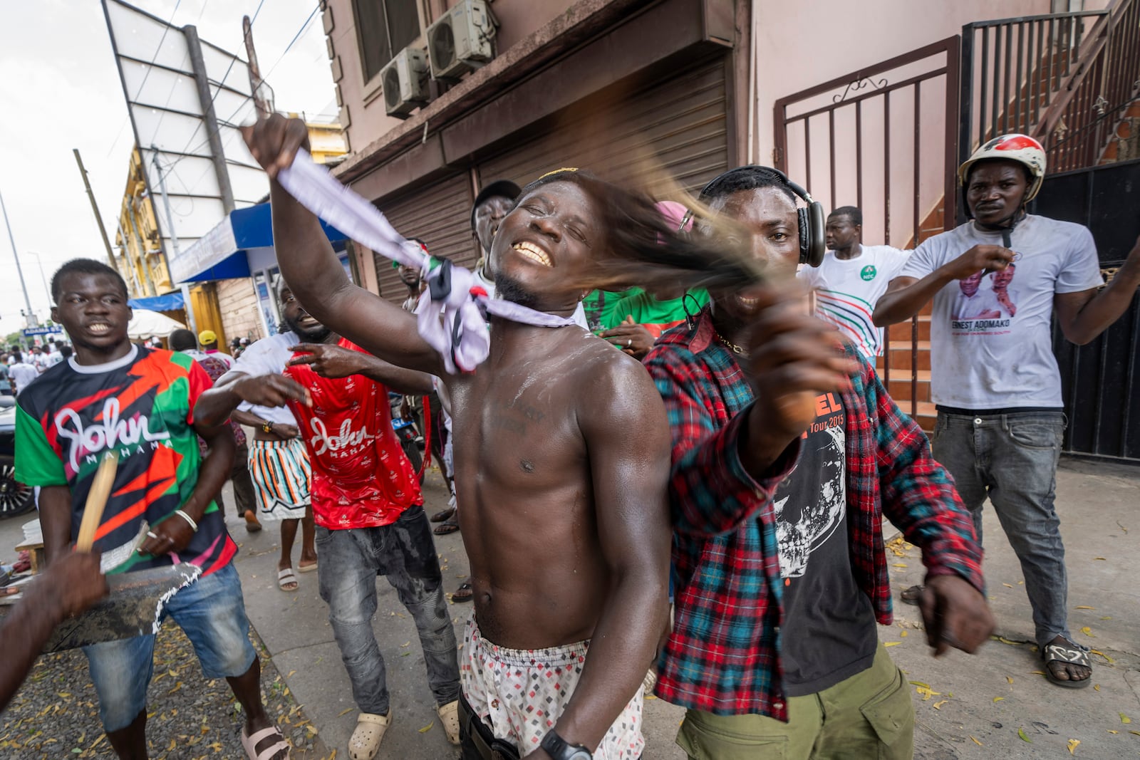 Supporters of opposition candidate and former President John Dramani Mahama celebrate his victory after his opponent Ghana’s vice president and ruling party candidate, Mahamudu Bawumia conceded in Accra, Ghana, Sunday, December 8, 2024. (AP Photo/Jerome Delay)