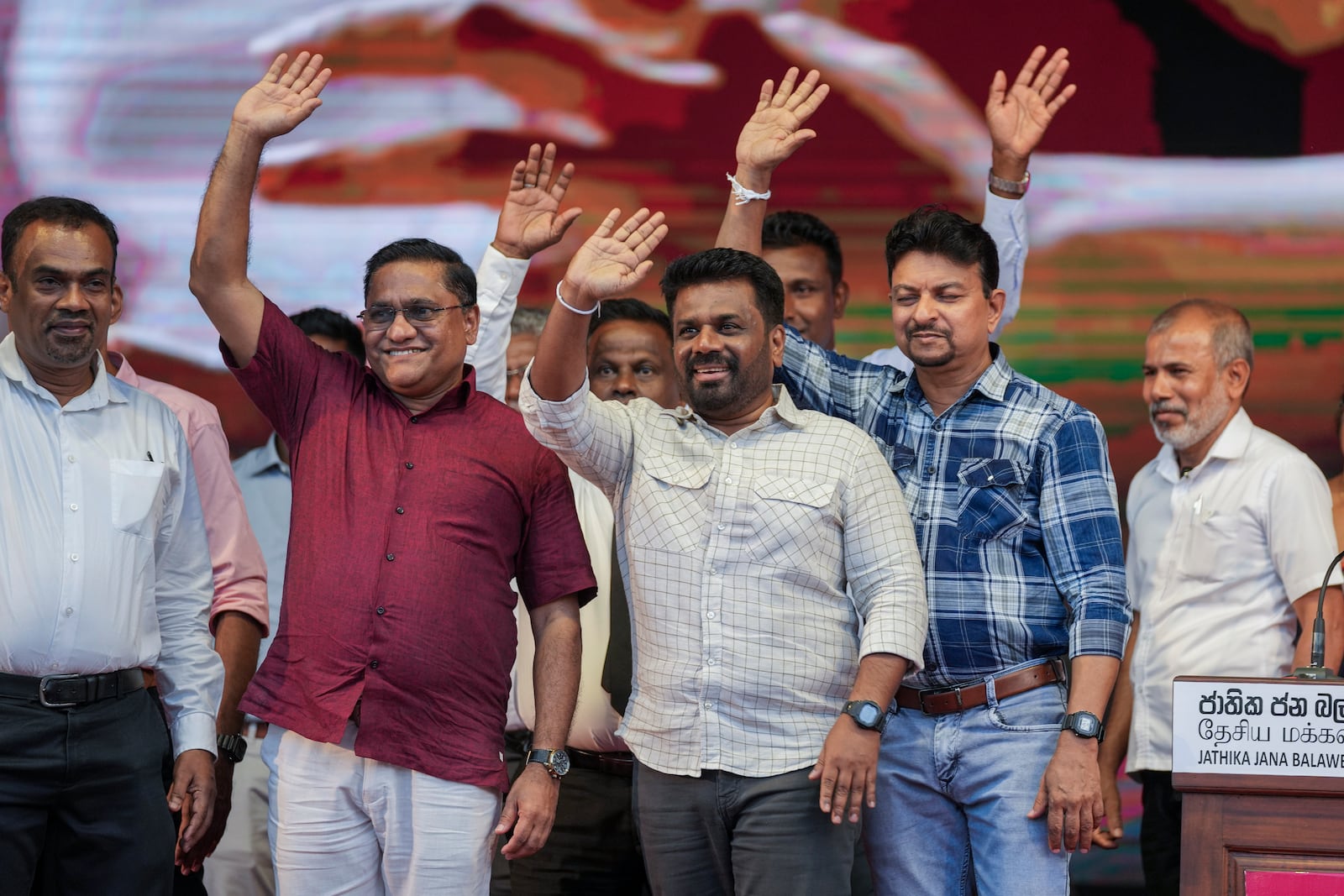 Sri Lankan President Anura Kumara Dissanayake waves with other candidates during a public rally ahead of Thursday's parliamentary election in Gampaha, Sri Lanka, Monday, Nov. 11, 2024. (AP Photo/Eranga Jayawardena)