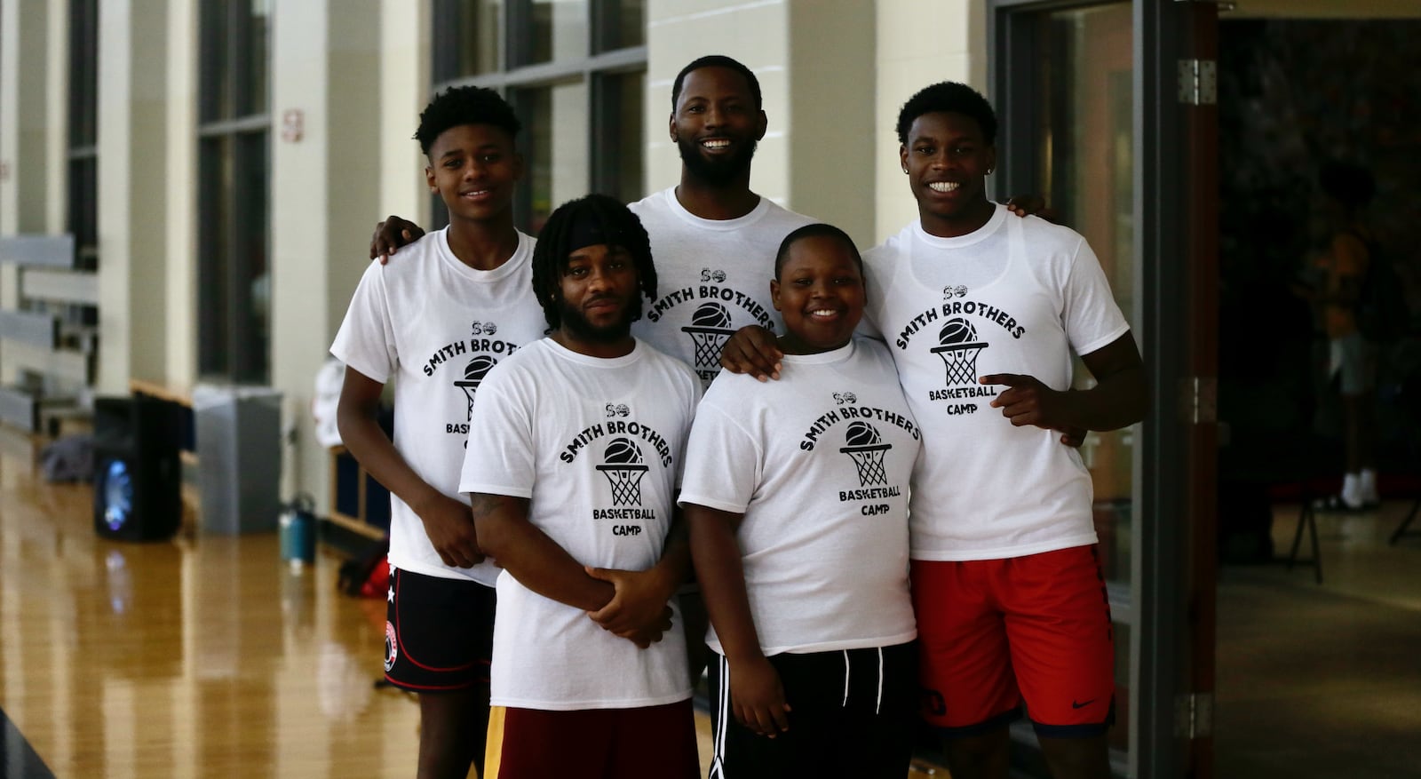 Scoochie Smith and Malachi Smith pose for a photo with family members who participated in the Smith Camp on Saturday, July 16, 2023, at the UD Rec Plex. David Jablonski/Staff