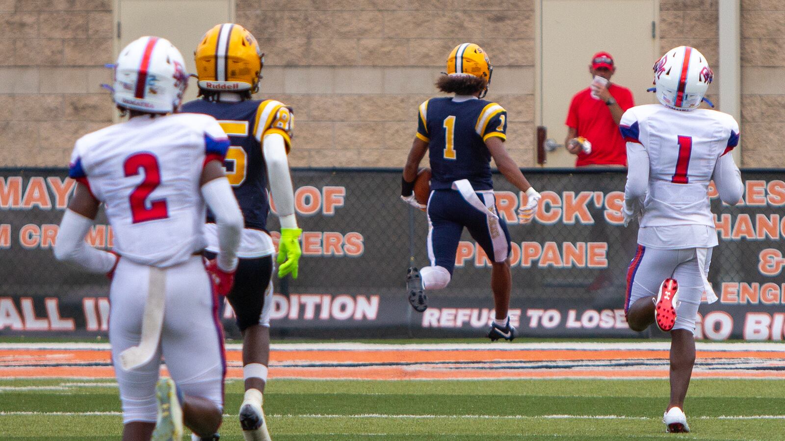 Da'Shawn Martin scores on a 70-yard touchdown pass from Brent Upshaw that tied the score 7-7 against DeMatha on Saturday in Ironton. Jeff Gilbert/CONTRIBUTED