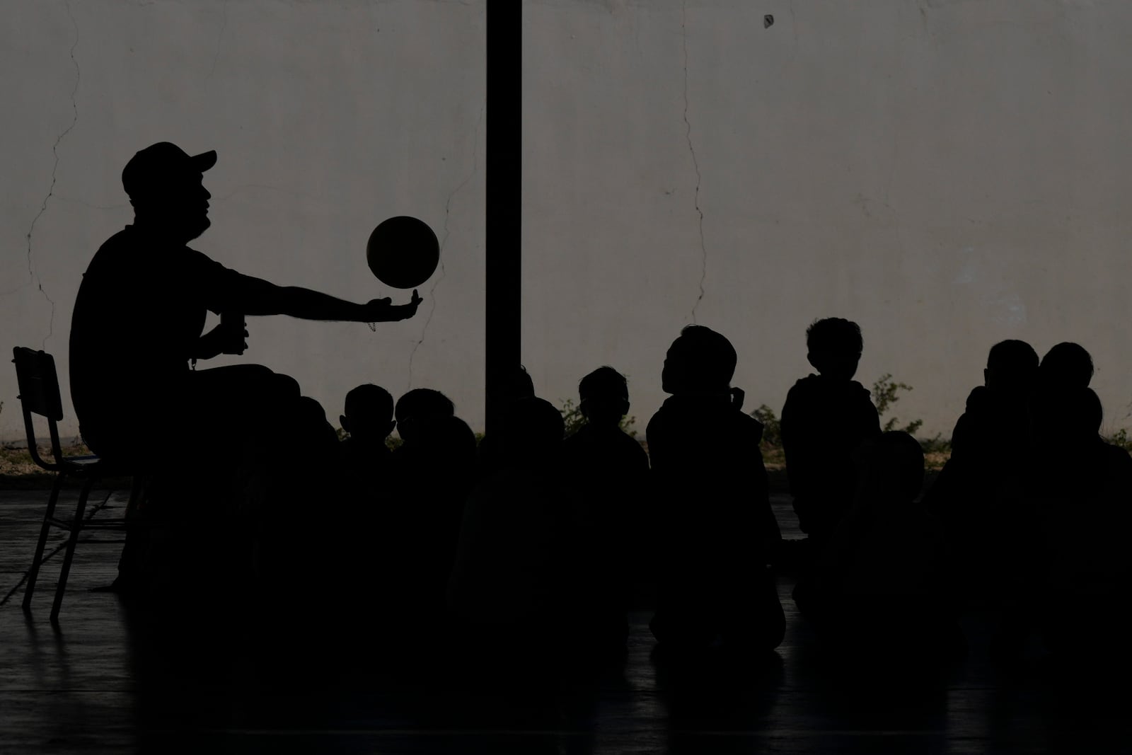 A teacher spins a ball on his finger during a class at Socrates Elementary School in Culiacan, Sinaloa state, Mexico, Thursday, Feb. 27, 2025. (AP Photo/Fernando Llano)