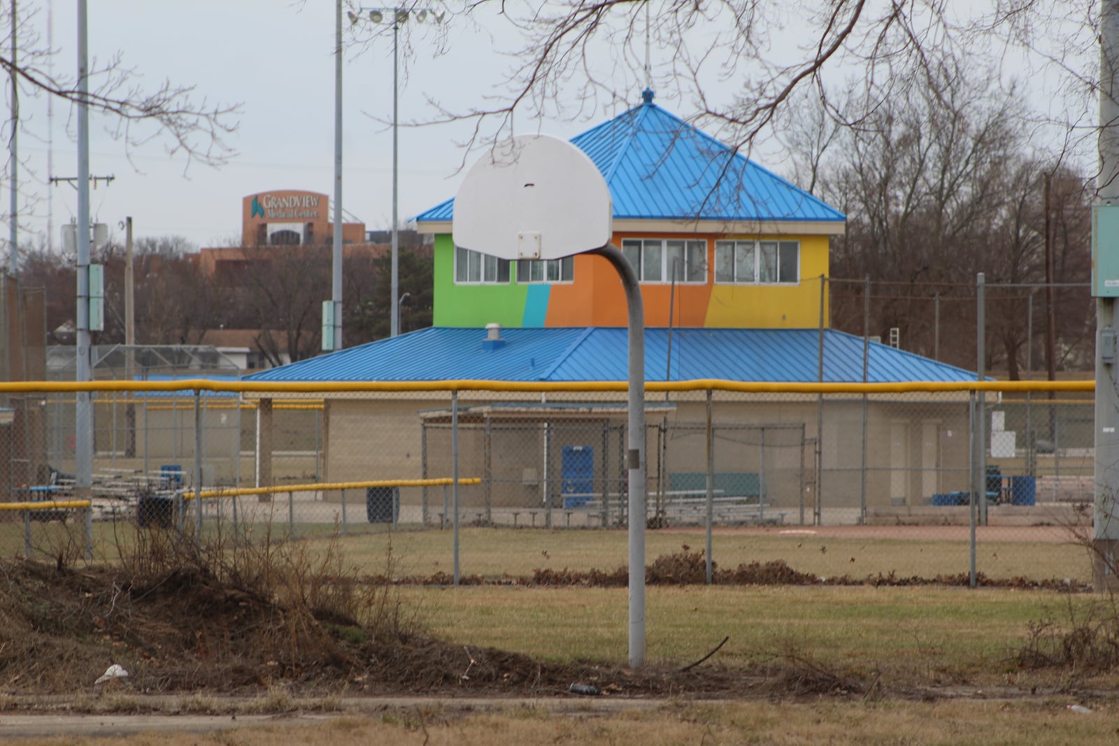 A neglected and unusable basketball court at Kettering Field in Dayton. CORNELIUS FROLIK / STAFF