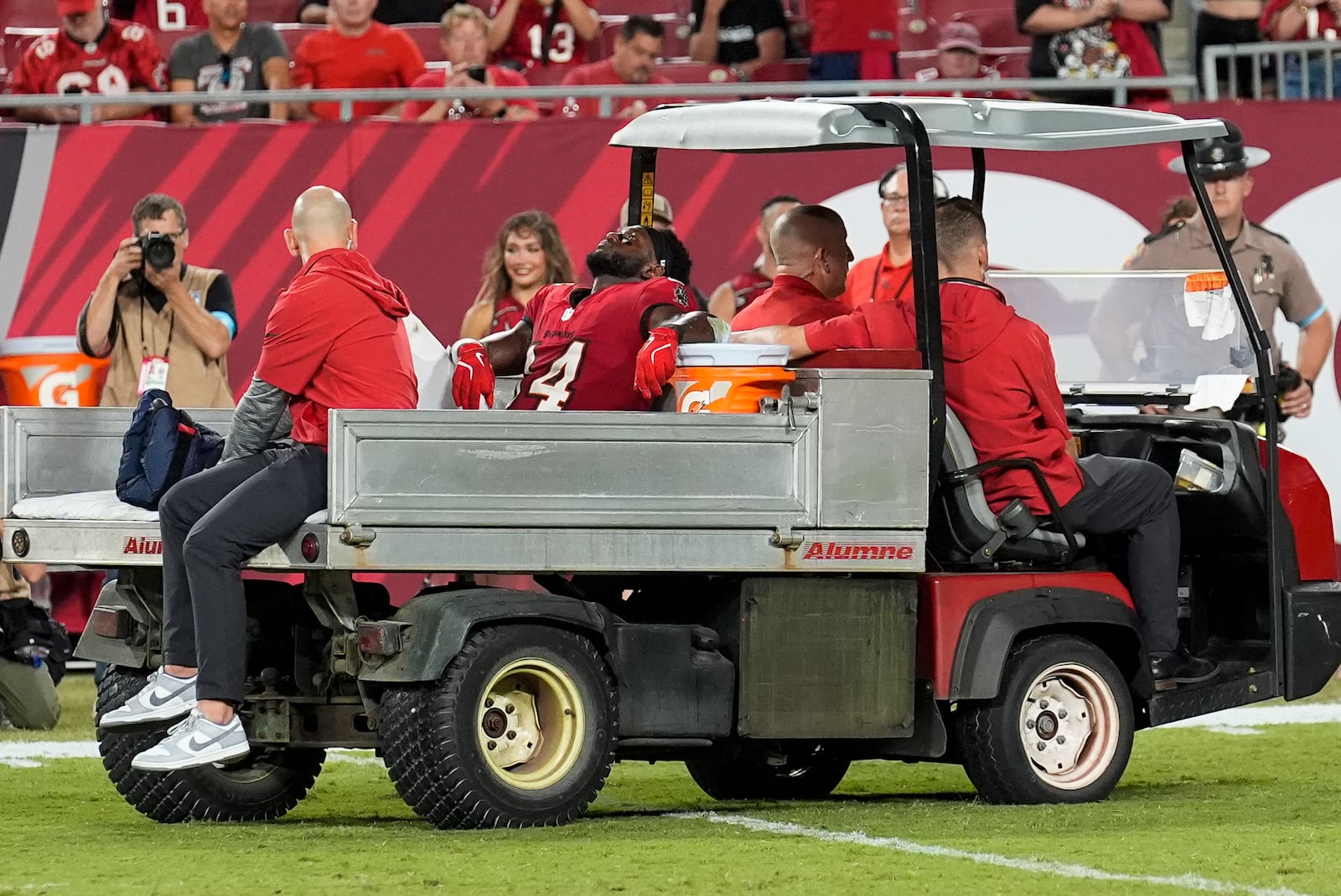 Tampa Bay Buccaneers wide receiver Chris Godwin (14) is carted off of the field after an injury during the second half of an NFL football game against the Baltimore Ravens, Monday, Oct. 21, 2024, in Tampa, Fla. (AP Photo/Chris O'Meara)