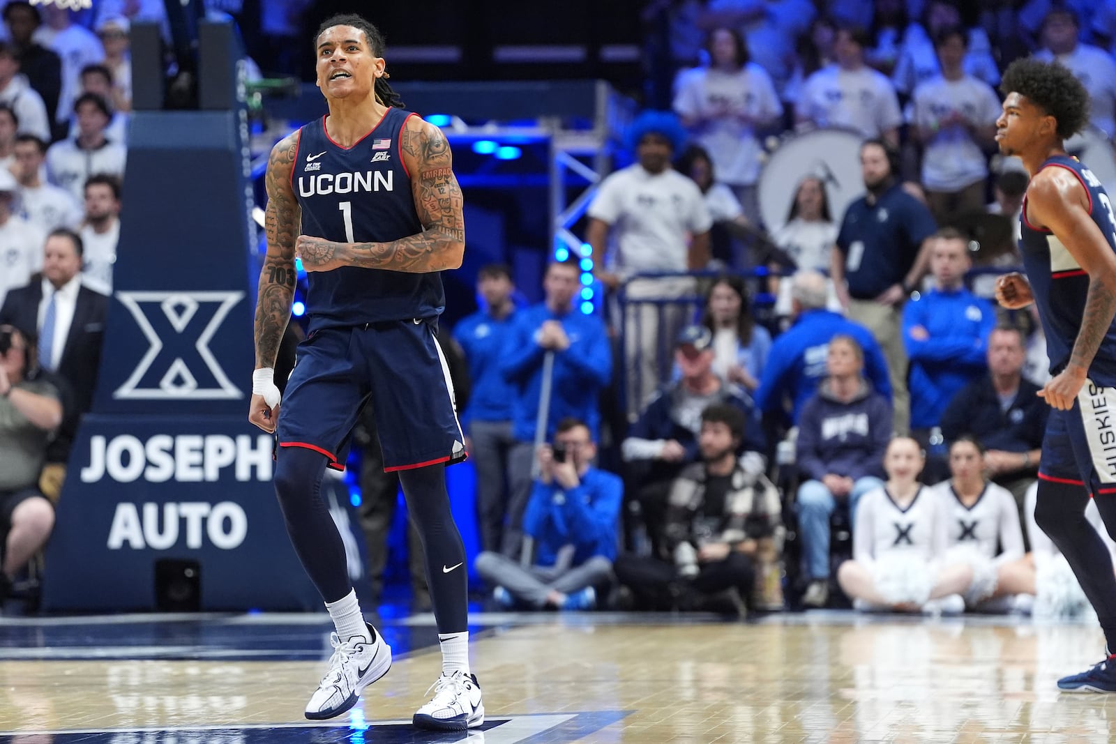 UConn's Solo Ball reacts after a made basket during the first half of an NCAA college basketball game against Xavier, Saturday, Jan. 25, 2025, Cincinnati. (AP Photo/Kareem Elgazzar)