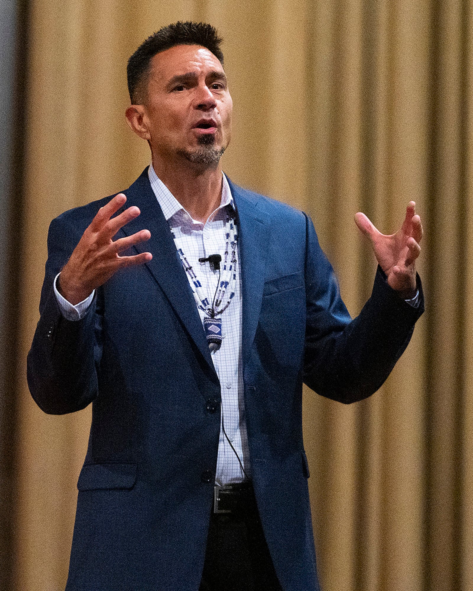 D.J. Vanas talks to Airmen about having the warrior spirit during his presentation June 24 at the Wright-Patterson Air Force Base Theater. The Ottawa Tribe member and former Air Force officer says tribal principles that led the first cultures in America can be applied today to lead organizations. U.S. AIR FORCE PHOTO/R.J.ORIEZ