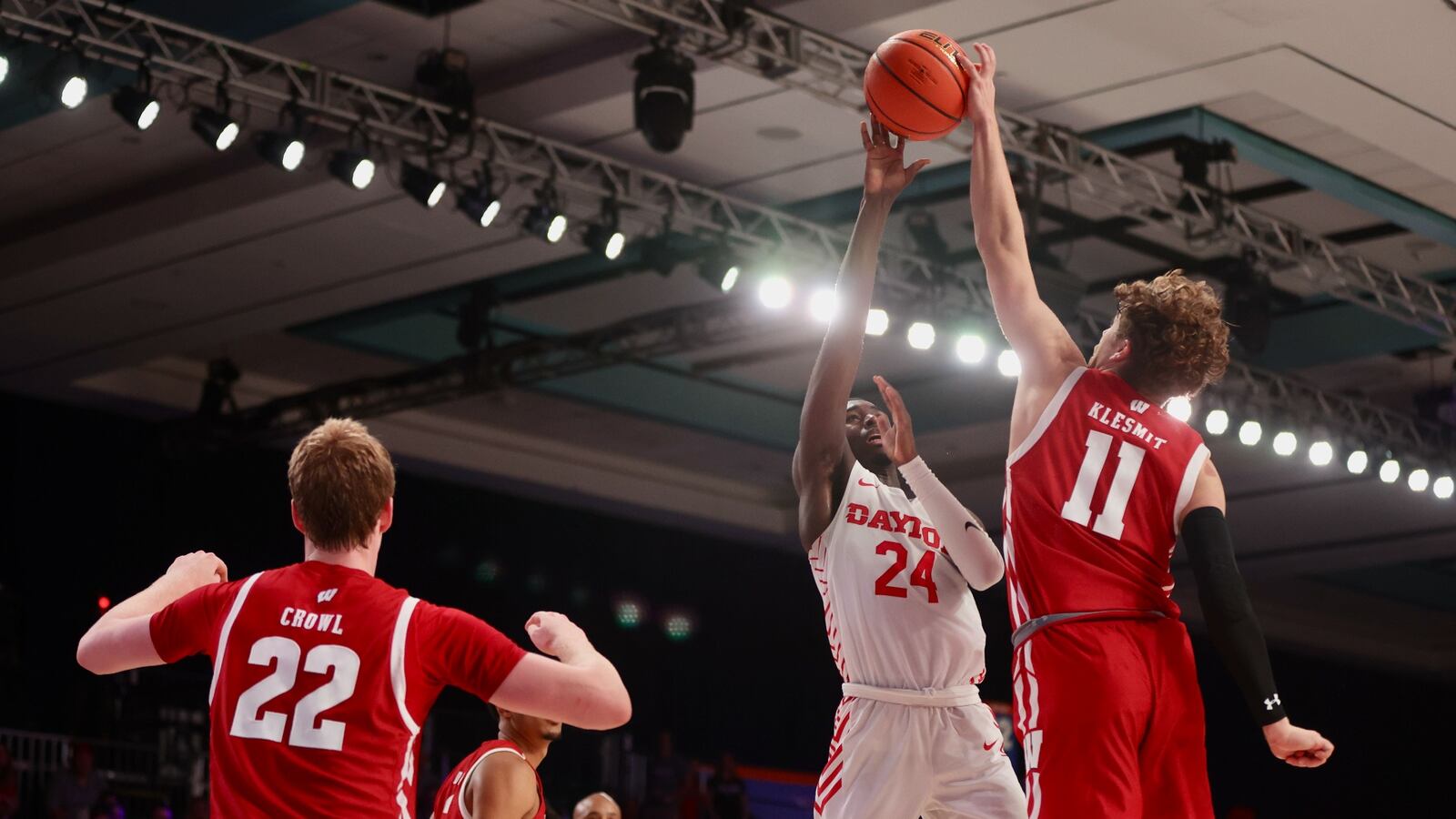 Dayton's Kobe Elvis has a shot blocked in the final seconds by Wisconsin's Max Klesmit on Wednesday, Nov. 23, 2022, in the first round of the Battle 4 Atlantis at Imperial Arena at the Paradise Island Resort in Nassau, Bahamas. David Jablonski/Staff