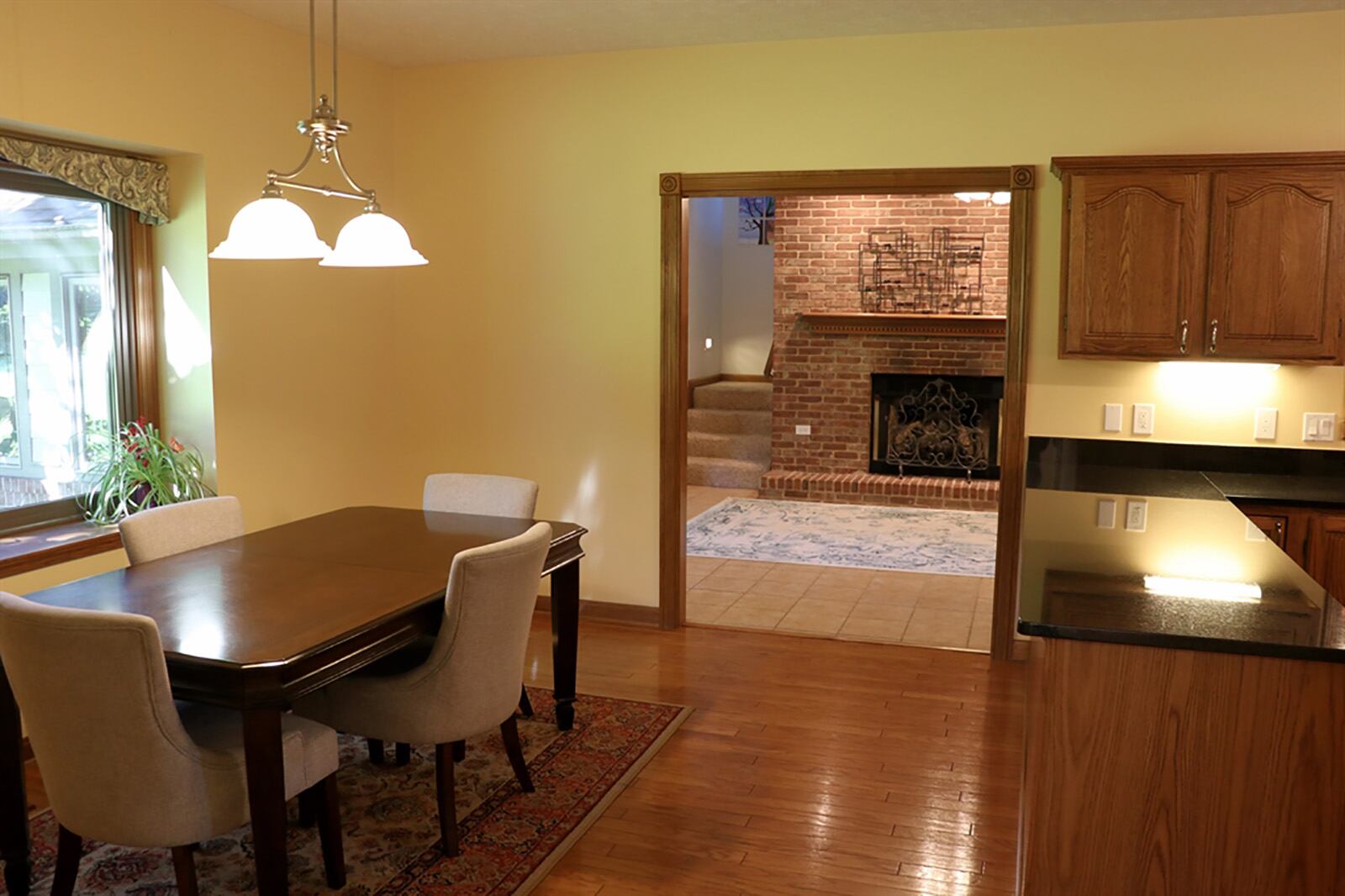 Hardwood floors fill the kitchen and breakfast room, which has a box window. Off the breakfast room is access to the half bathroom and ends within the laundry room. CONTRIBUTED PHOTO BY KATHY TYLER