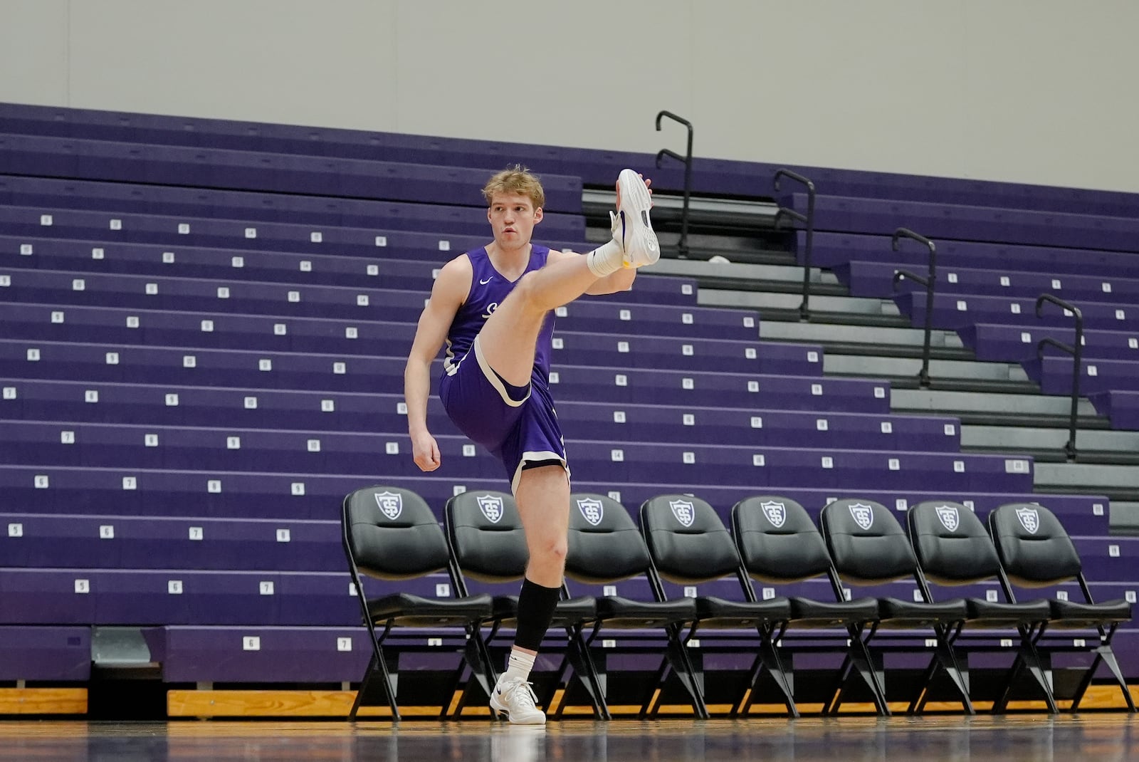 St. Thomas guard Drake Dobbs (11) stretches during NCAA college basketball practice, Wednesday, Feb. 26, 2025, in St. Paul, Minn. (AP Photo/Abbie Parr)