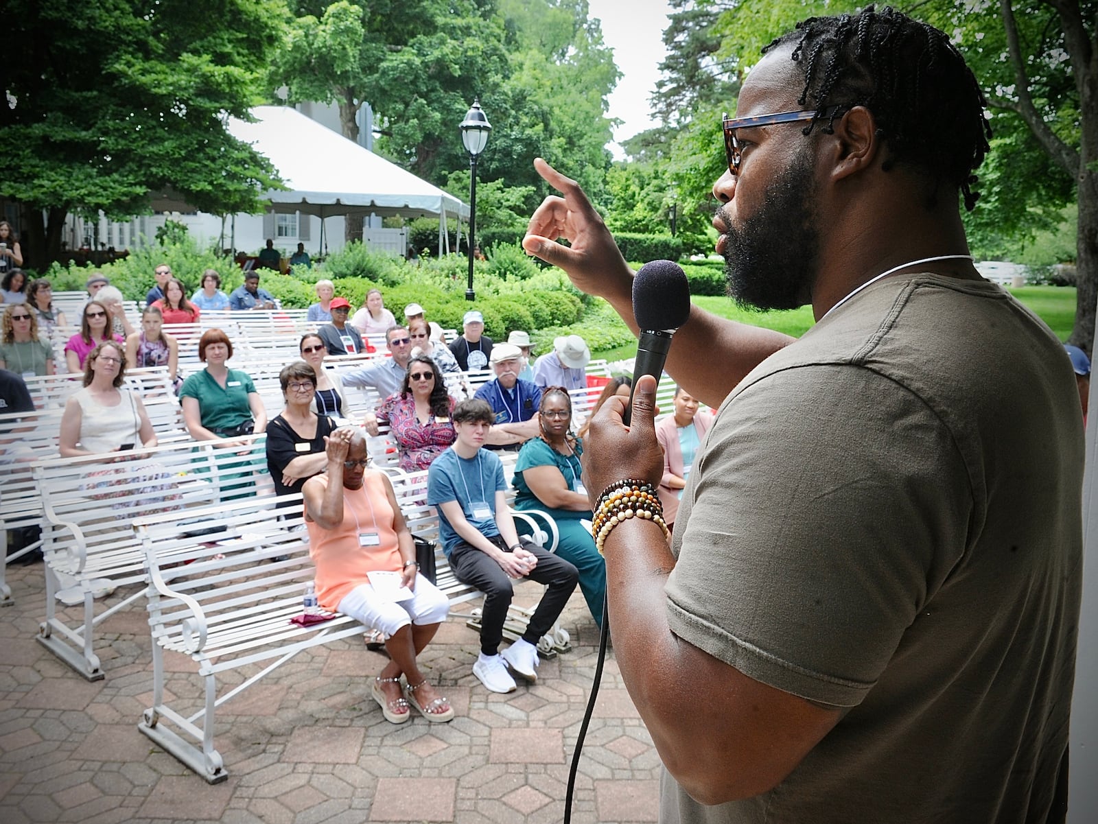 Faheem Curtis-Khidr, professor at Sinclair Community College, gave the keynote speech, Black in the Promised Land: Understanding the Local National and Historical Importance of Juneteenth, at Kettering's Polen Farm on June 20, 2022.  MARSHALL GORBY \ STAFF