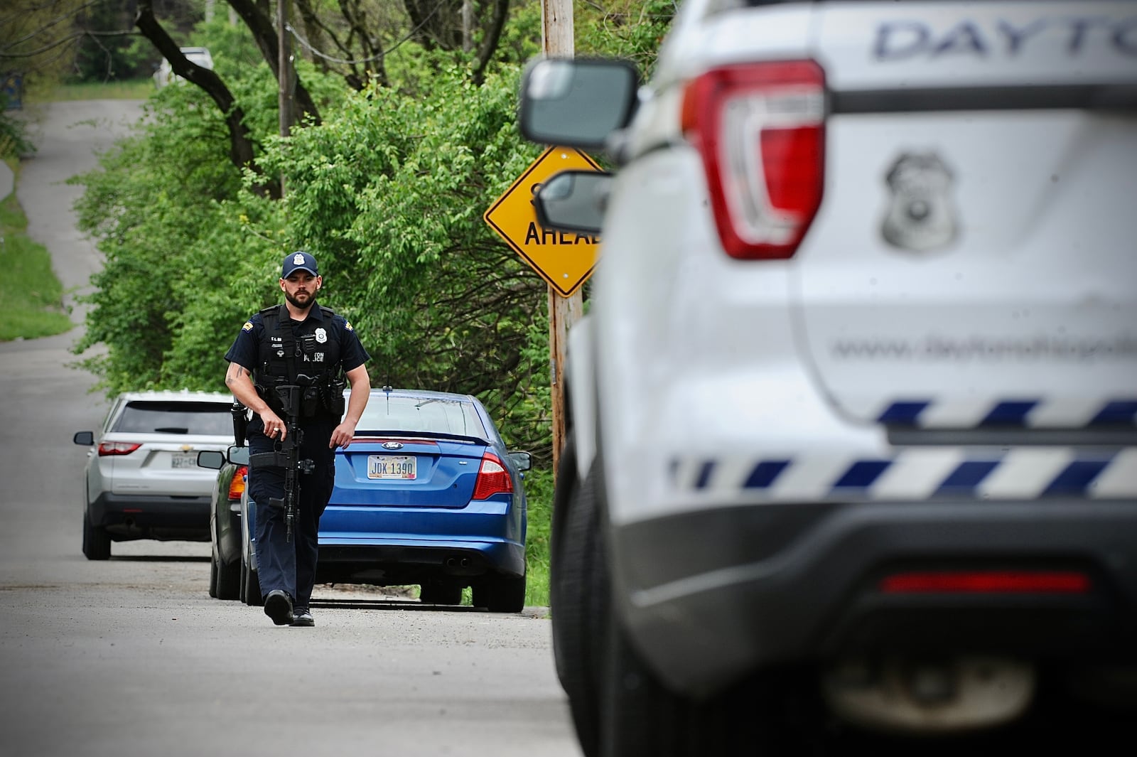 Dayton police looking for armed suspect in wooded area near Gettysburg and McCall Avenue. Suspect Rammed a police cruiser and ran.