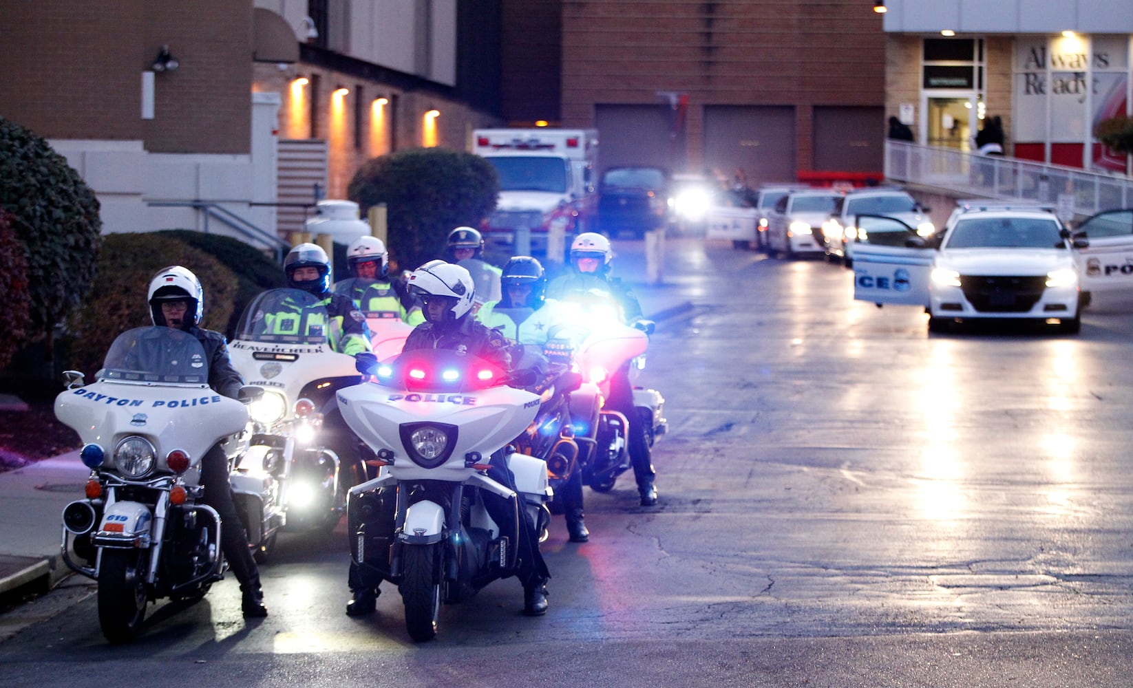 PHOTOS: People line street for fallen Dayton detective’s processional