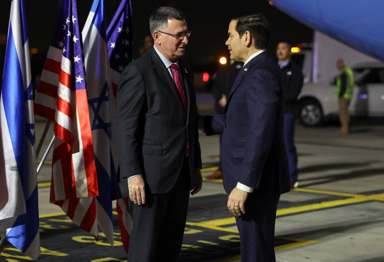 Israel's Foreign Minister Gideon Sa'ar welcomes U.S. Secretary of State Marco Rubio as he arrives in Israel, on the first leg of his Middle East trip, in Tel Aviv, Israel, on Saturday, Feb. 15, 2025. (Evelyn Hockstein/Pool Photo via AP)