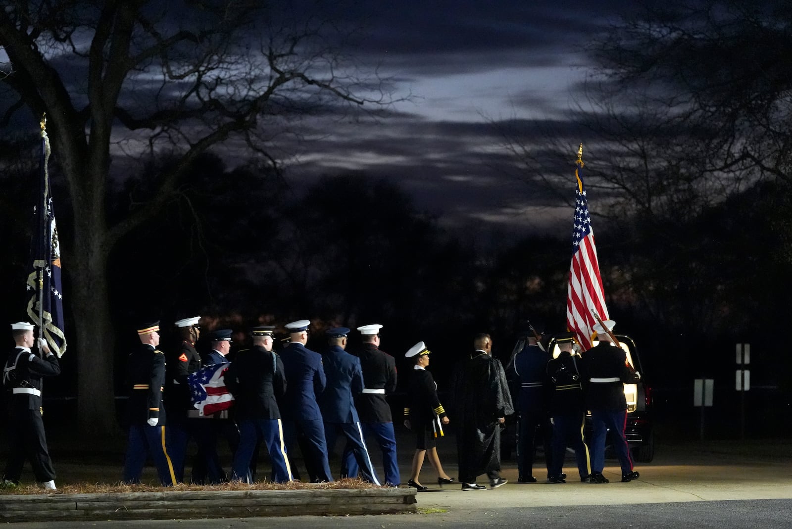 A joint services body bearer team carries the casket after the funeral service for former President Jimmy Carter at Maranatha Baptist Church in Plains, Ga., Thursday, Jan. 9, 2025. Carter died Dec. 29 at the age of 100. (AP Photo/Alex Brandon, Pool)