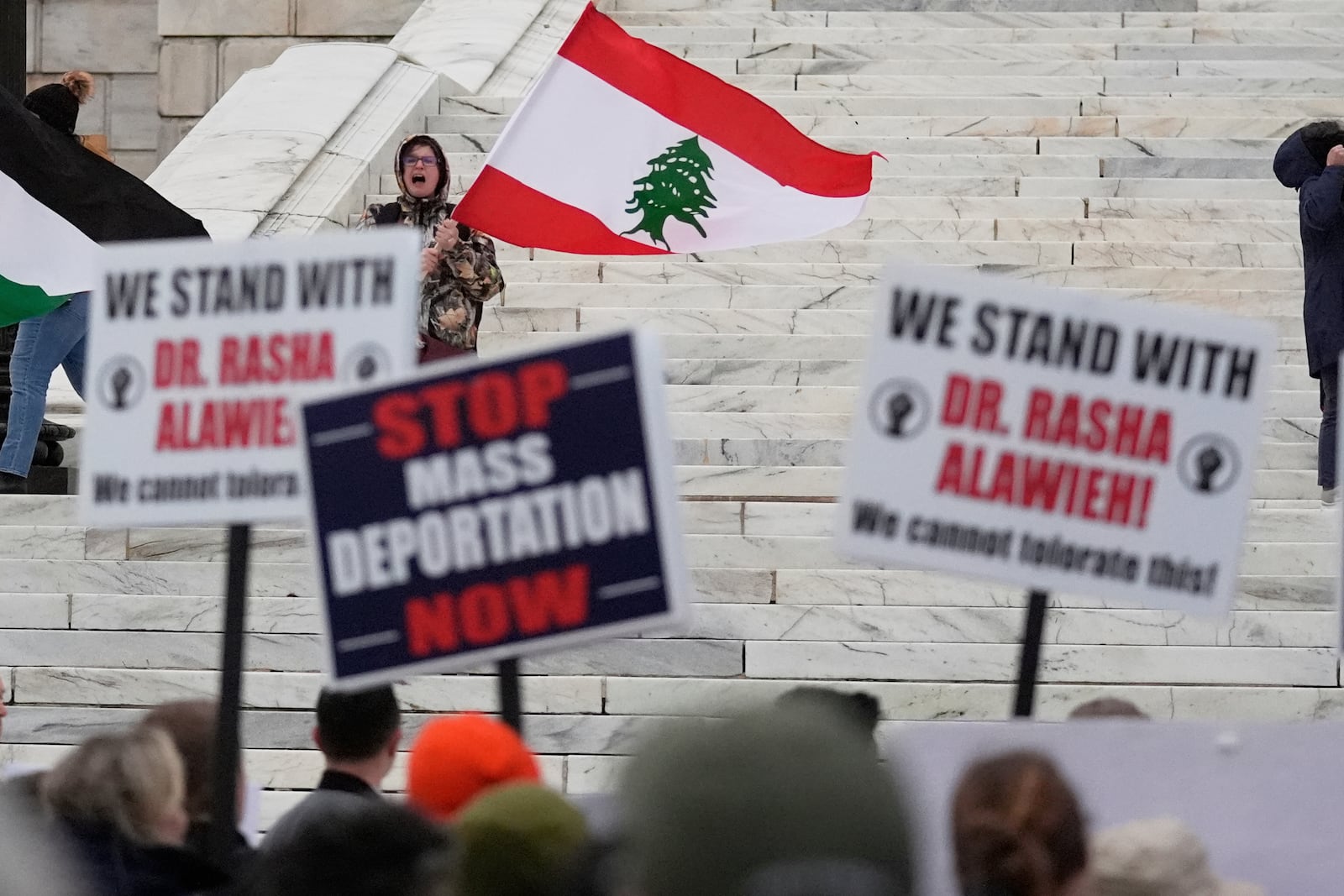 Protesters rally outside the Rhode Island State House in support of deported Brown University Dr. Rasha Alawieh, Monday, March 17, 2025, in Providence, R.I. (AP Photo/Charles Krupa)