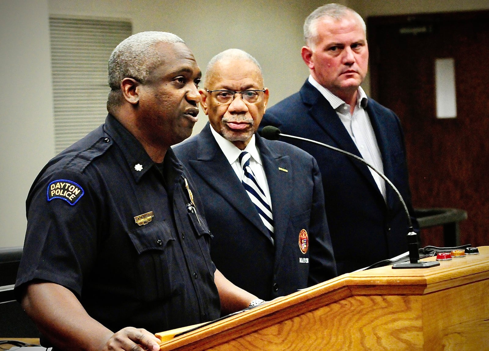 Lt. Col. Eric Henderson of the Dayton Police Department, Dayton Mayor Jeffrey Mims, Jr and Deputy City Manager Joe Parlette talked to the media Wednesday, June 26, 2024 about multiple shootings earlier this week that injured 13 and killed 2. MARSHALL GORBY\STAFF